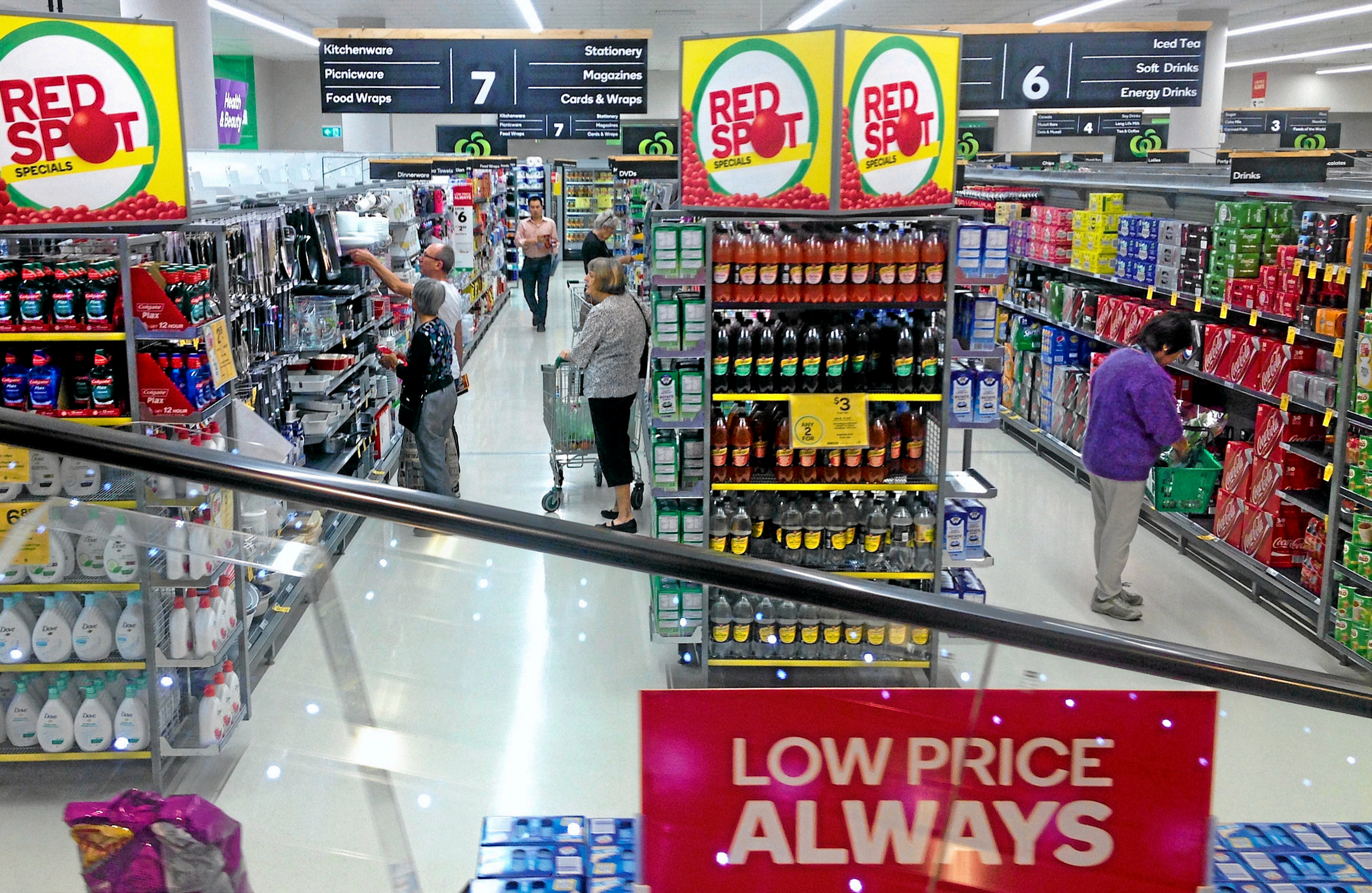 Australian Coles supermarket, showing aisles and a red sign at the front that says "Lower Price ALWAYS"