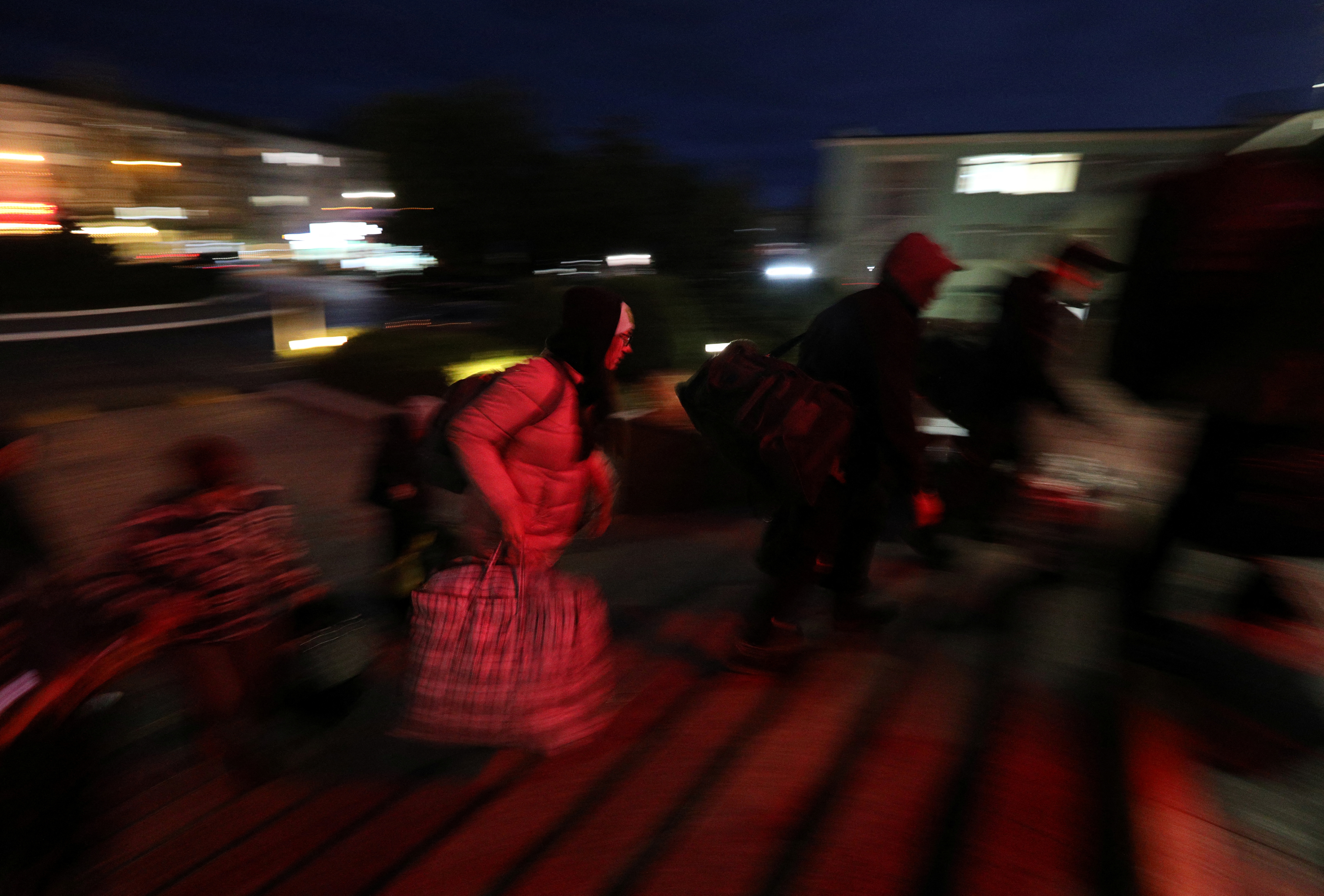 Civilian evacuees arrive at a train station