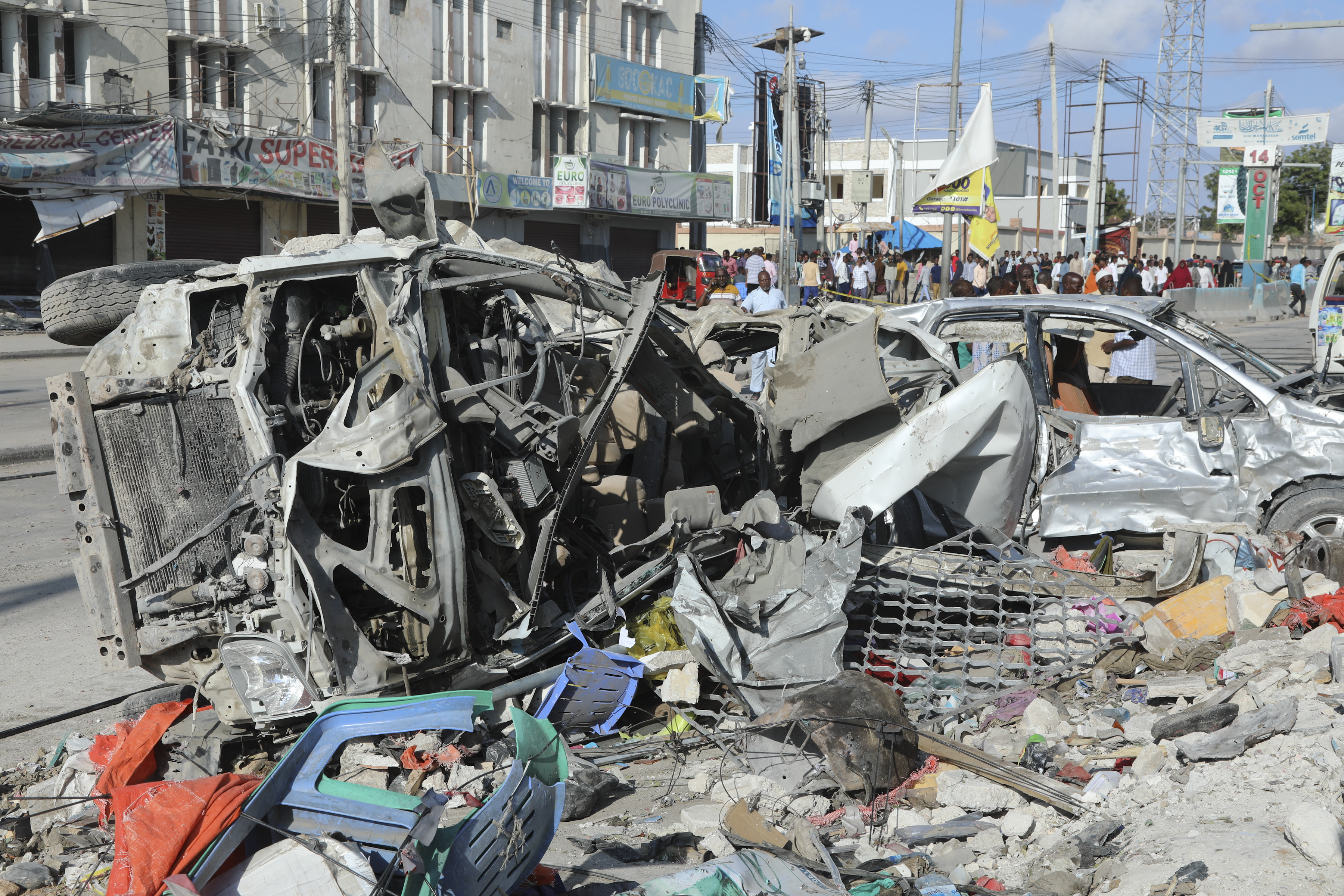 This photograph taken October 30, 2022 shows a destroyed cars after an car bombing targeted the education ministry in Mogadishu on October 29, 2022. - Two huge car bombings rocked Somalia's education ministry in the capital Mogadishu causing casualties and shattering windows of nearby buildings, police and witnesses said. The "simultaneous explosions occurred along the Zobe road and there are various casualties. (Photo by HASSAN ALI ELMI / AFP)