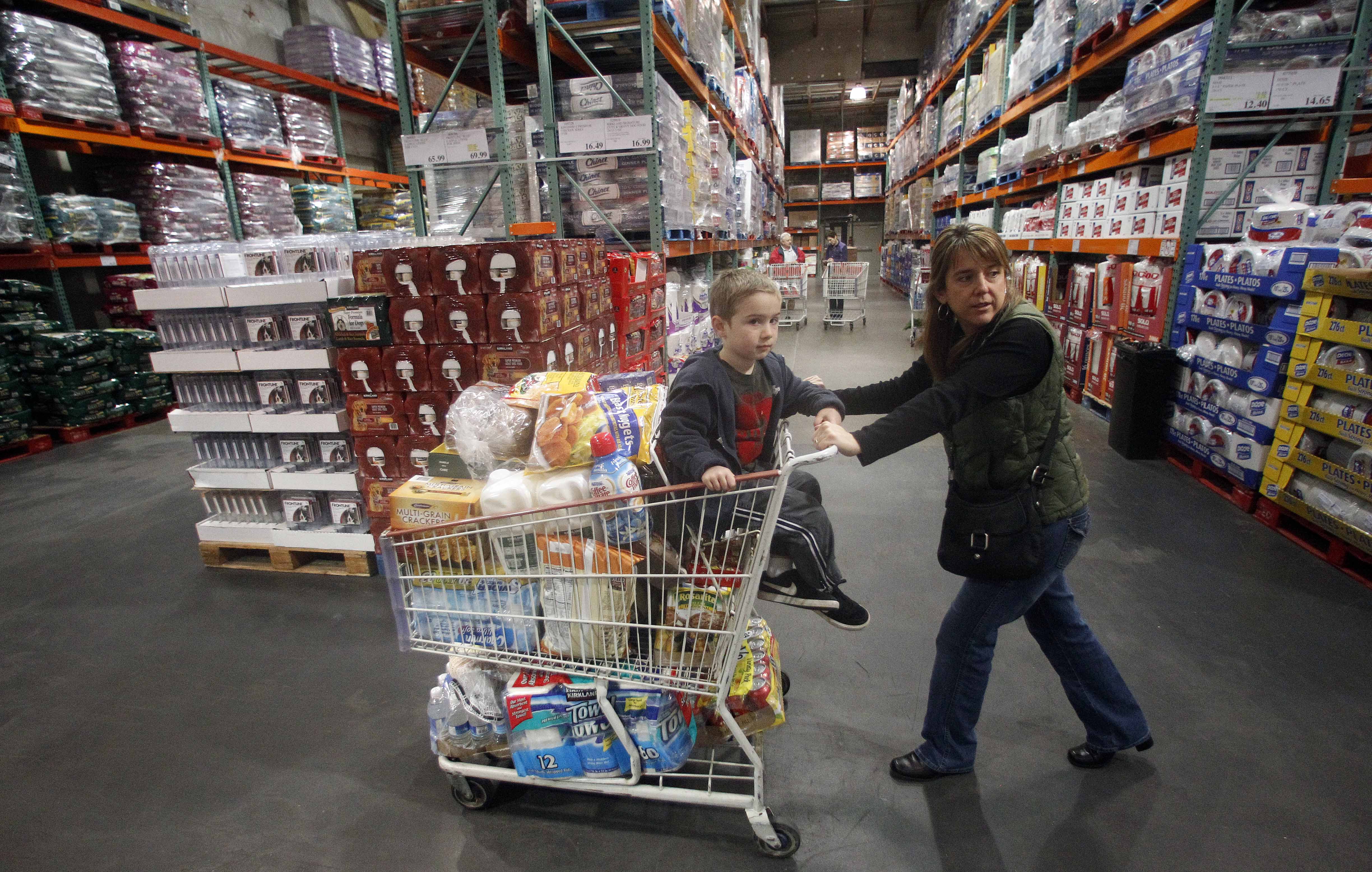 Tina VanPelt and her son Soloman, 4, shop at a Costco store, in, Portland, Ore.