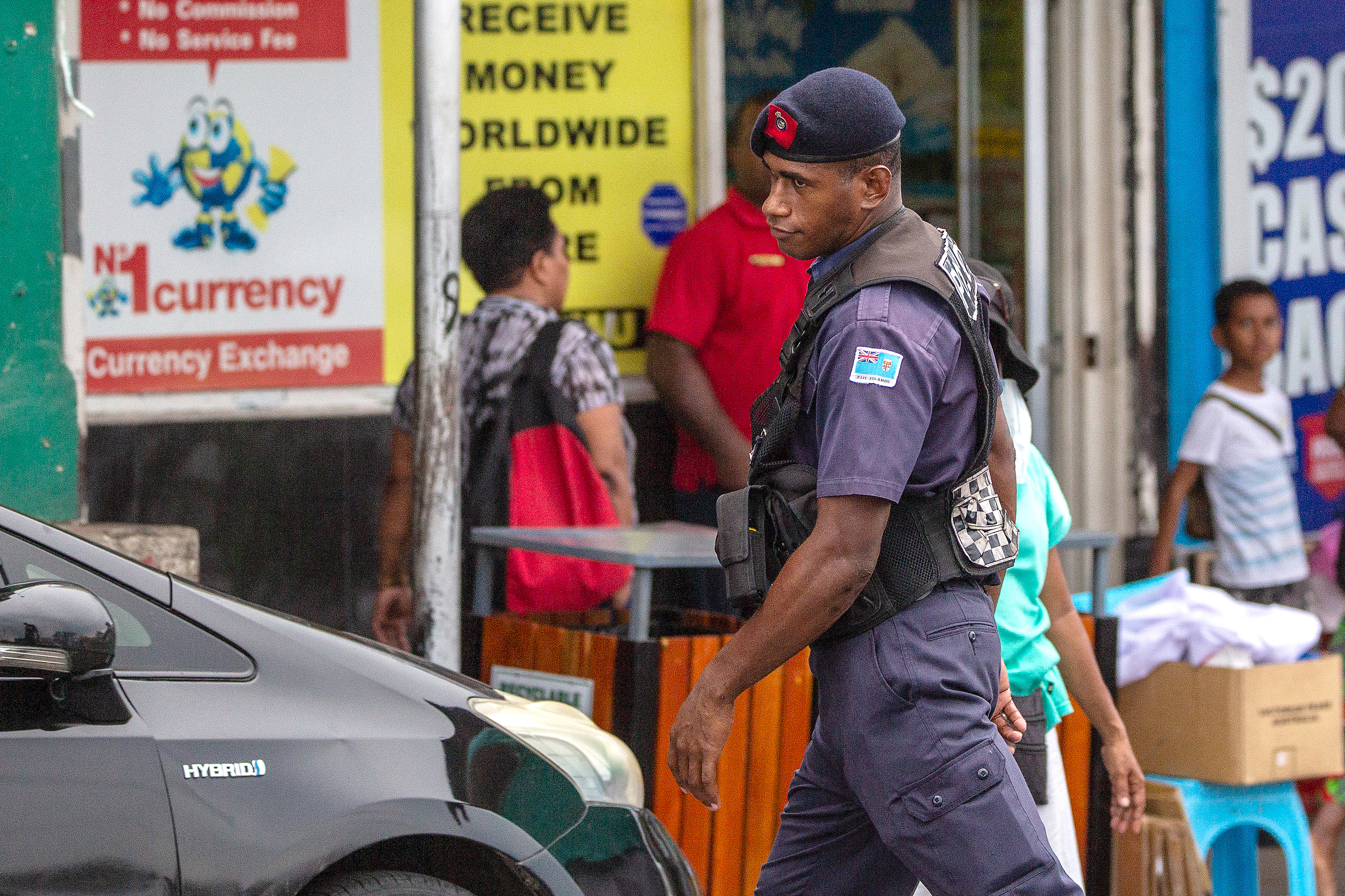 A policeman patrols a street in Fiji&#39;s capital Suva on December 22, 2022 [Leon Lord/AFP]