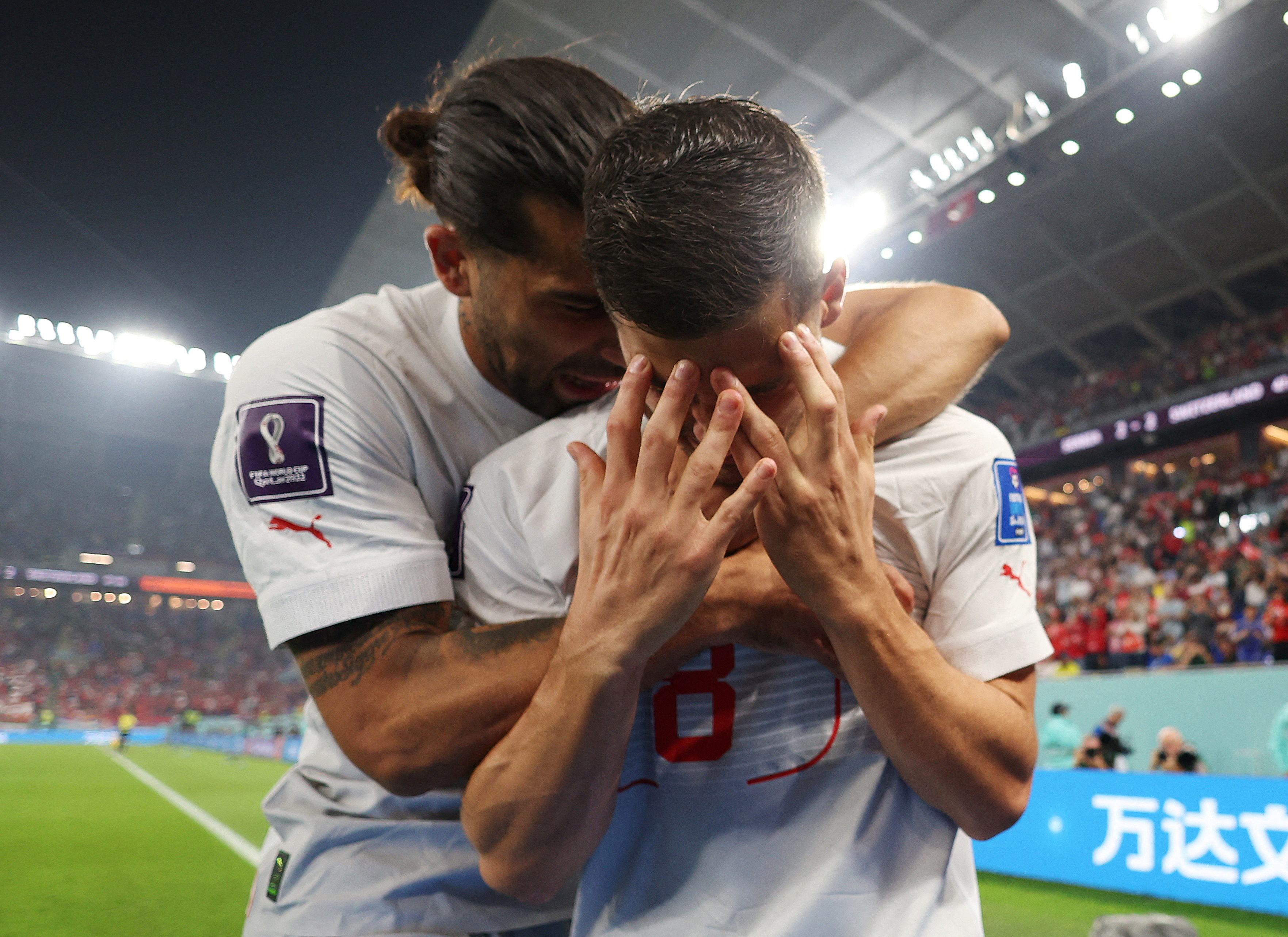 Soccer Football - FIFA World Cup Qatar 2022 - Group G - Serbia v Switzerland - Stadium 974, Doha, Qatar - December 2, 2022 Switzerland's Remo Freuler celebrates scoring their third goal with teammates with Ricardo Rodriguez REUTERS/Suhaib Salem TPX IMAGES OF THE DAY
