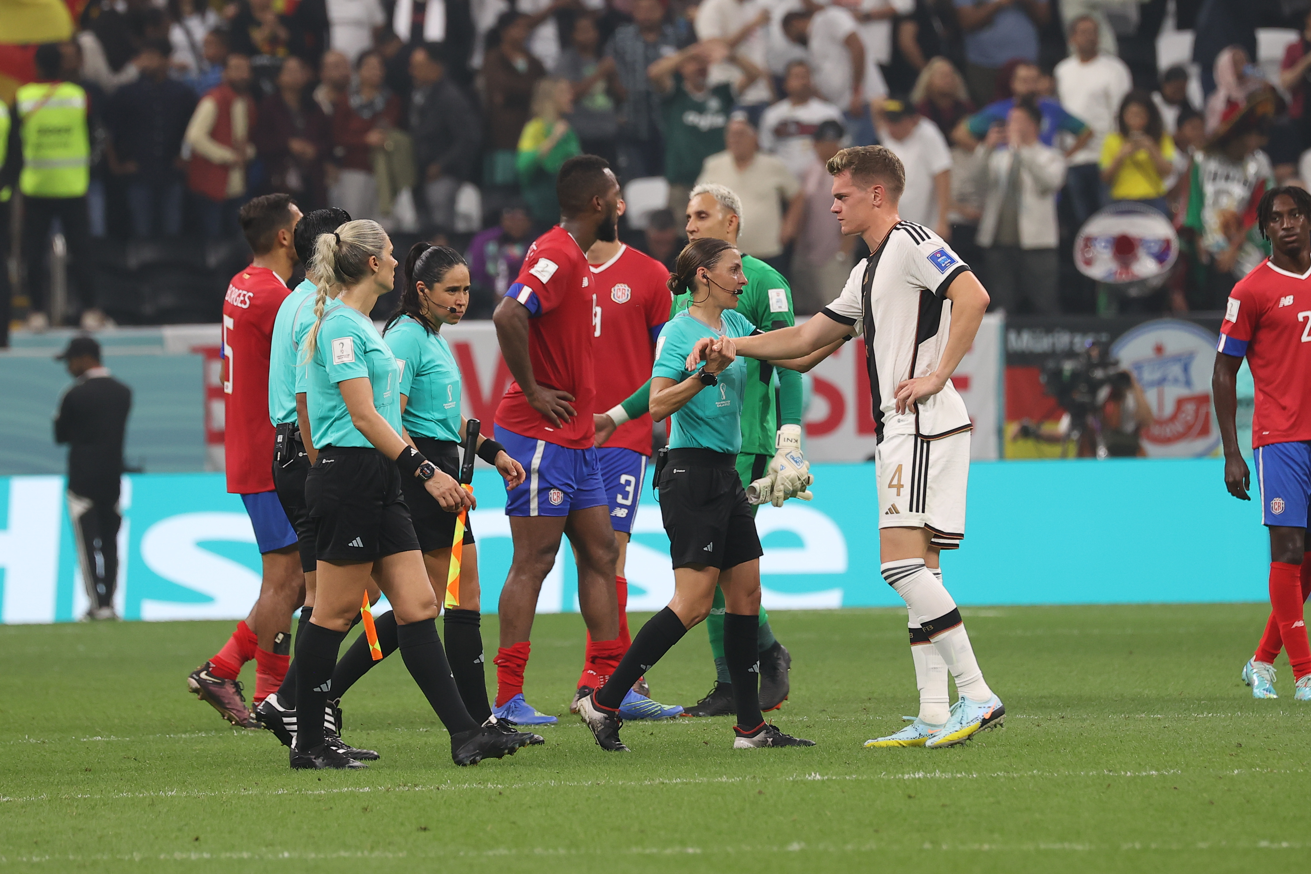 Players shaking hands with officials