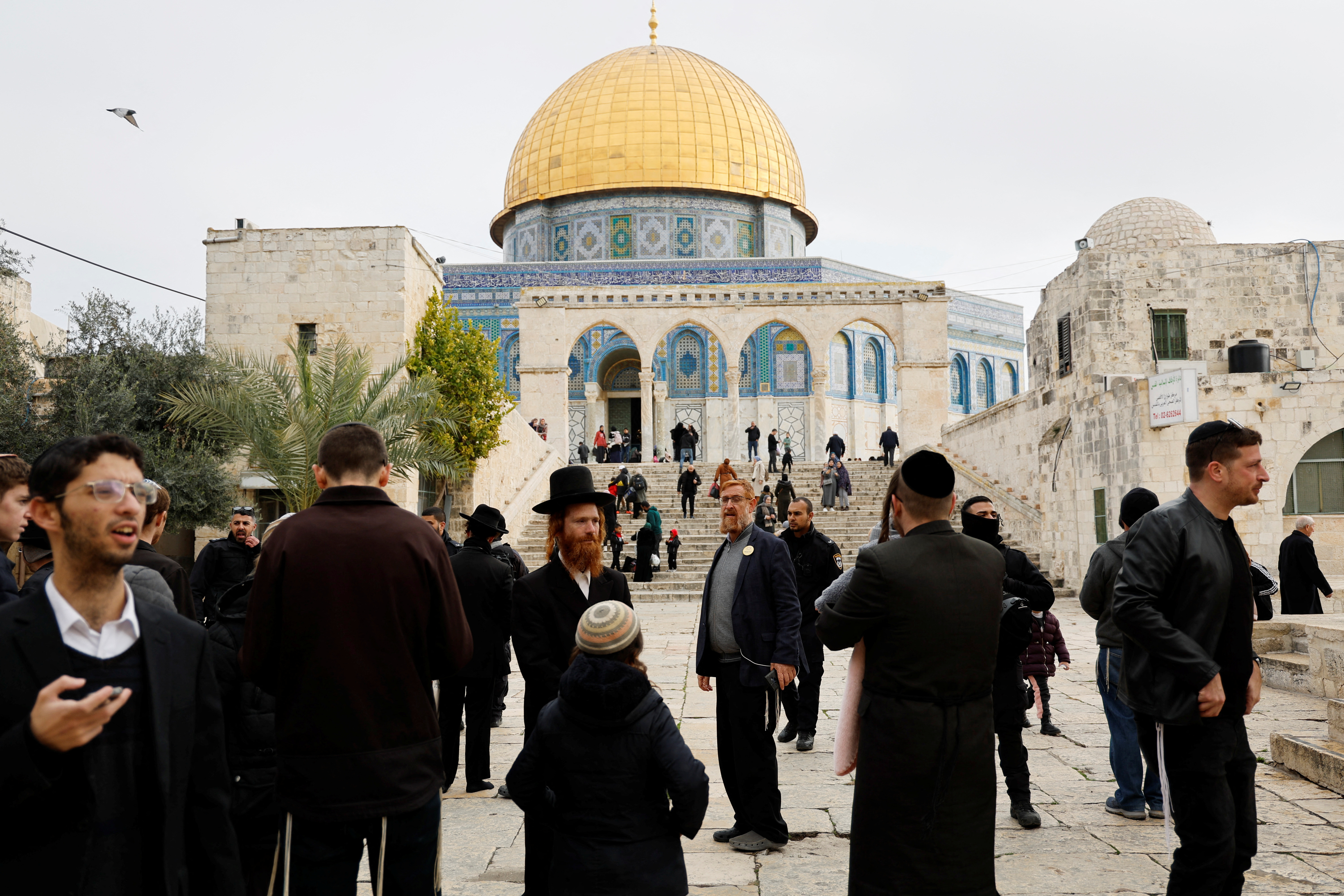 Visitors gather near the Dome of the Rock on the compound known to Muslims as the Noble Sanctuary and to Jews as the Temple Mount, in Jerusalem's Old City January 3, 2023. REUTERS/Ammar Awad