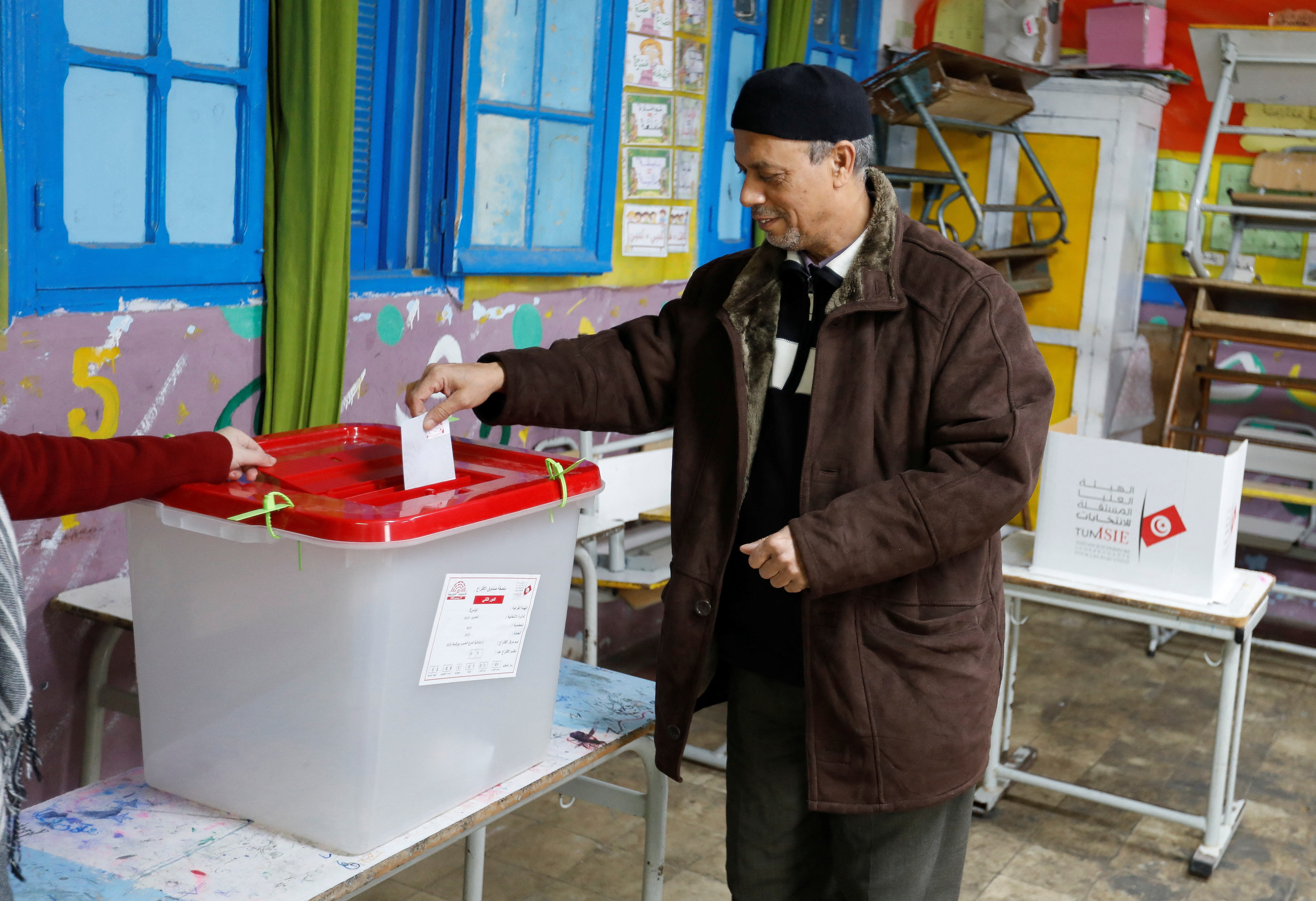 A voter casts his ballot at a polling station during the second round of the parliamentary election in Tunis, Tunisia January 29, 2023. REUTERS/Zoubeir Souissi