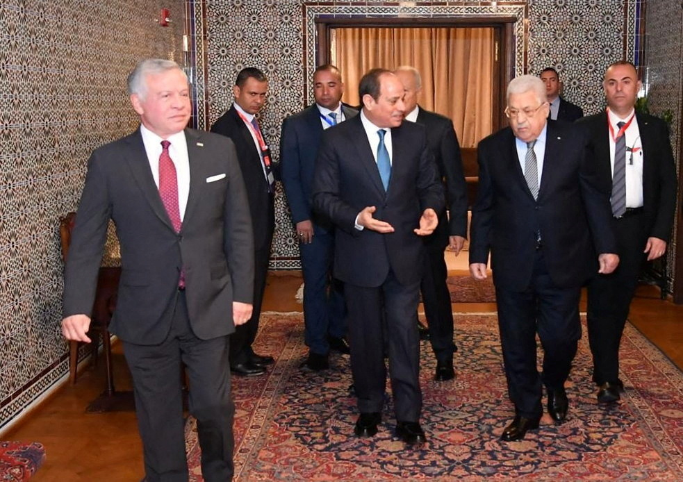 Egyptian President Abdel Fattah al-Sisi (C) talks with Palestinian President Mahmoud Abbas and Jordan's King Abdullah II before departing from Cairo Airport after attending the Jerusalem resilience and development conference with Arab leaders at the Arab League's headquarters in Cairo, Egypt, February 12, 2023 in this handout picture courtesy of the Egyptian Presidency. The Egyptian Presidency/Handout via REUTERS ATTENTION EDITORS - THIS IMAGE HAS BEEN SUPPLIED BY A THIRD PARTY.