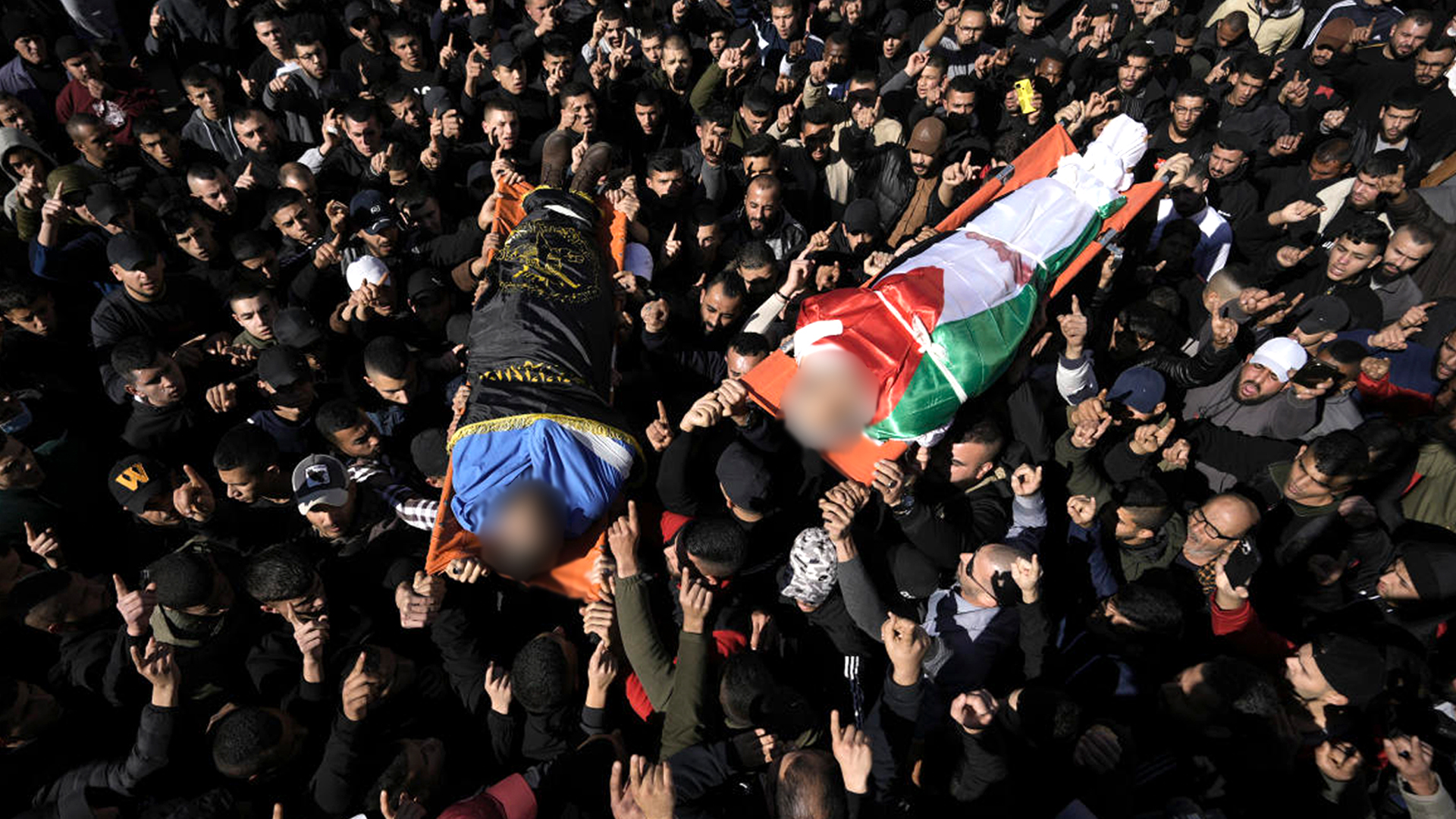 People attend a funeral of Palestinians killed by Israel
