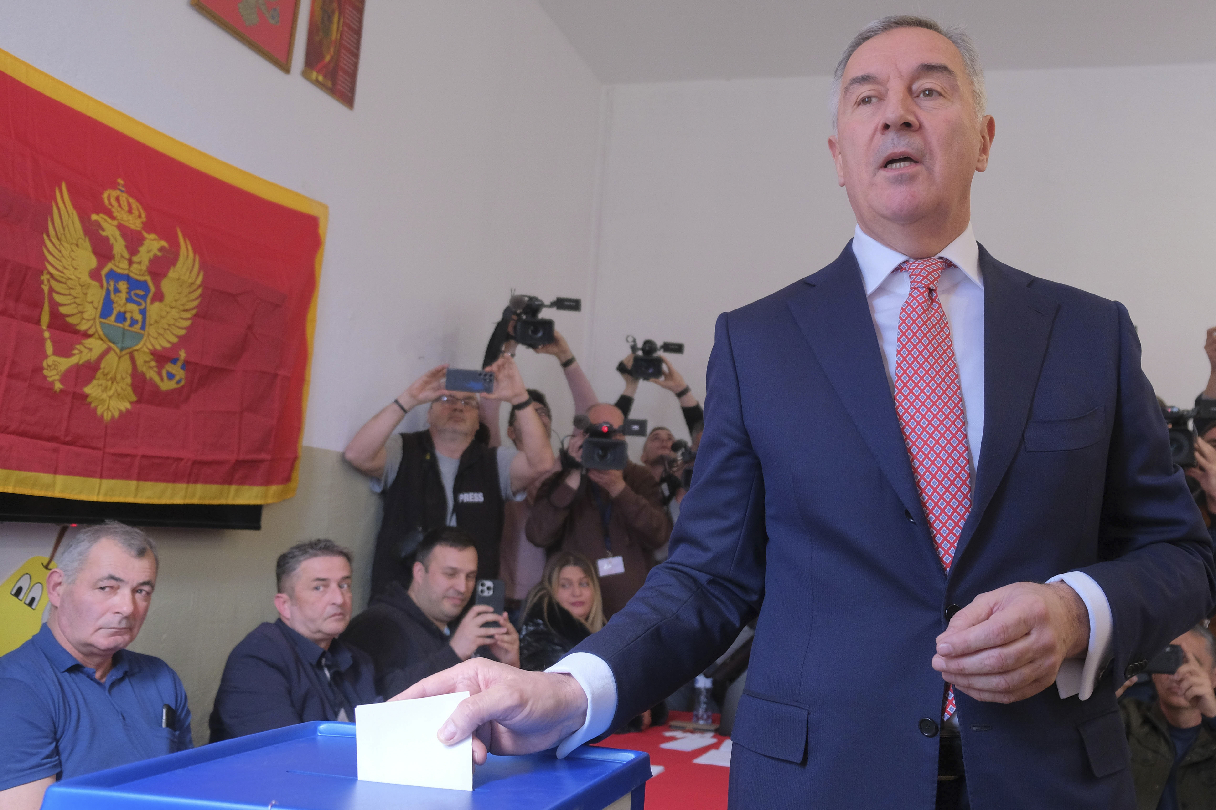 Pro-Western incumbent Milo Djukanovic casts his ballot at the polling station in Montenegro's capital Podgorica, Sunday, March 19, 2023. Voters in Montenegro are casting ballots Sunday in a presidential election marked by political turmoil and uncertainty over whether the small NATO member state in the Balkans will unblock its bid to join the European Union or seek to improve ties with Serbia and Russia. (AP Photo/Risto Bozovic)