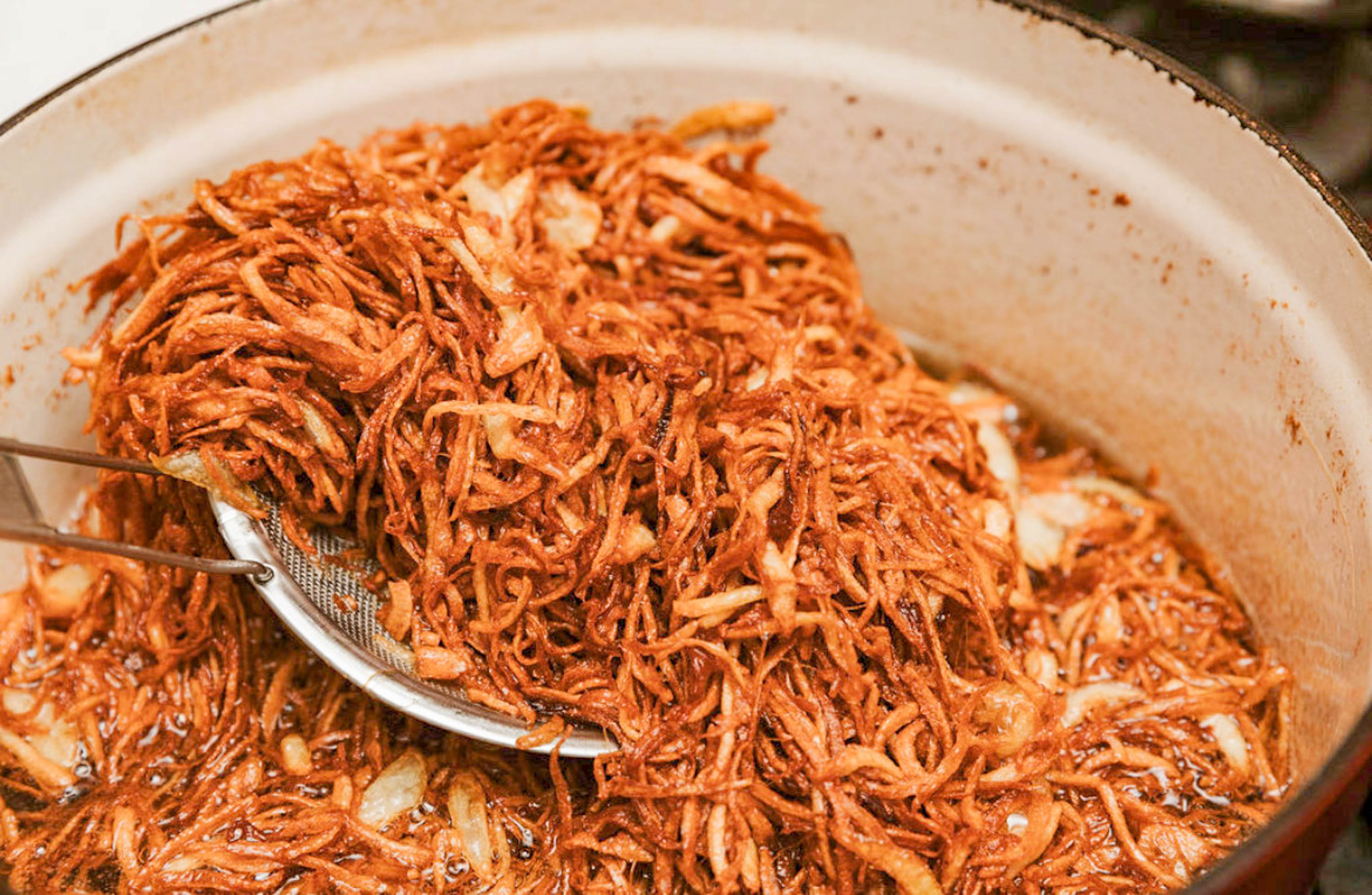 Fried onions in a pot