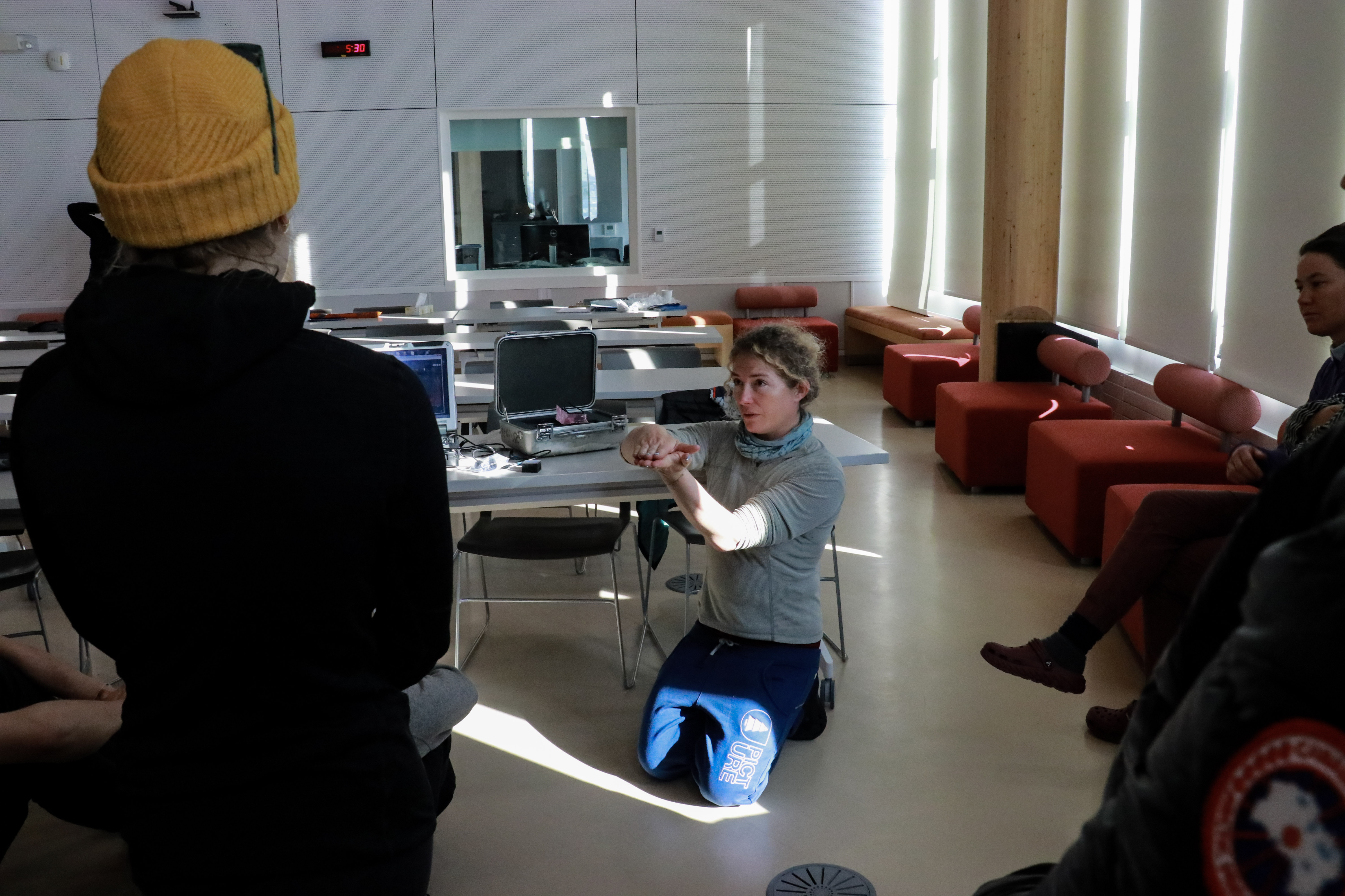 A researcher explains the use of a tool for measuring albedo light