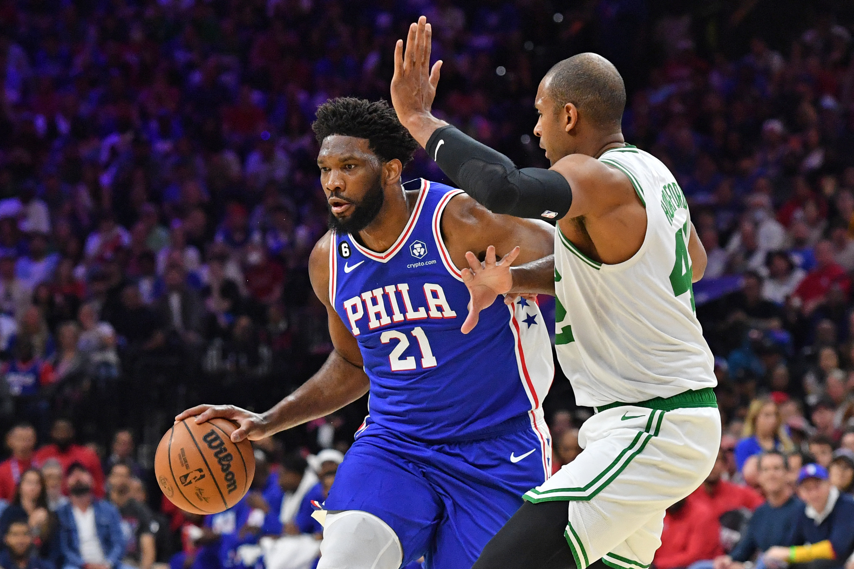 Philadelphia 76ers center Joel Embiid drives to the basket against Boston Celtics centre Al Horford