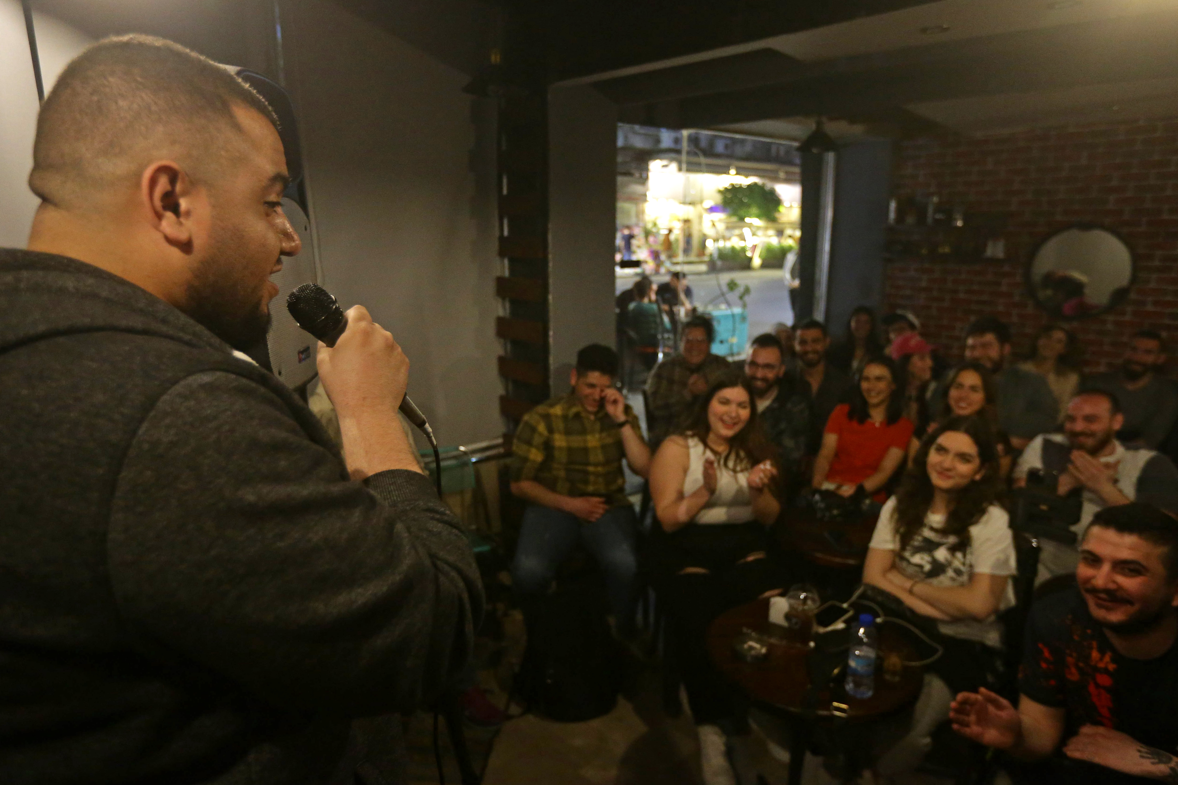 Hussein al-Rawi performs during a comedy night titled "Styria" which is an Arabic mash-up of Syria and hysteria, in Damascus