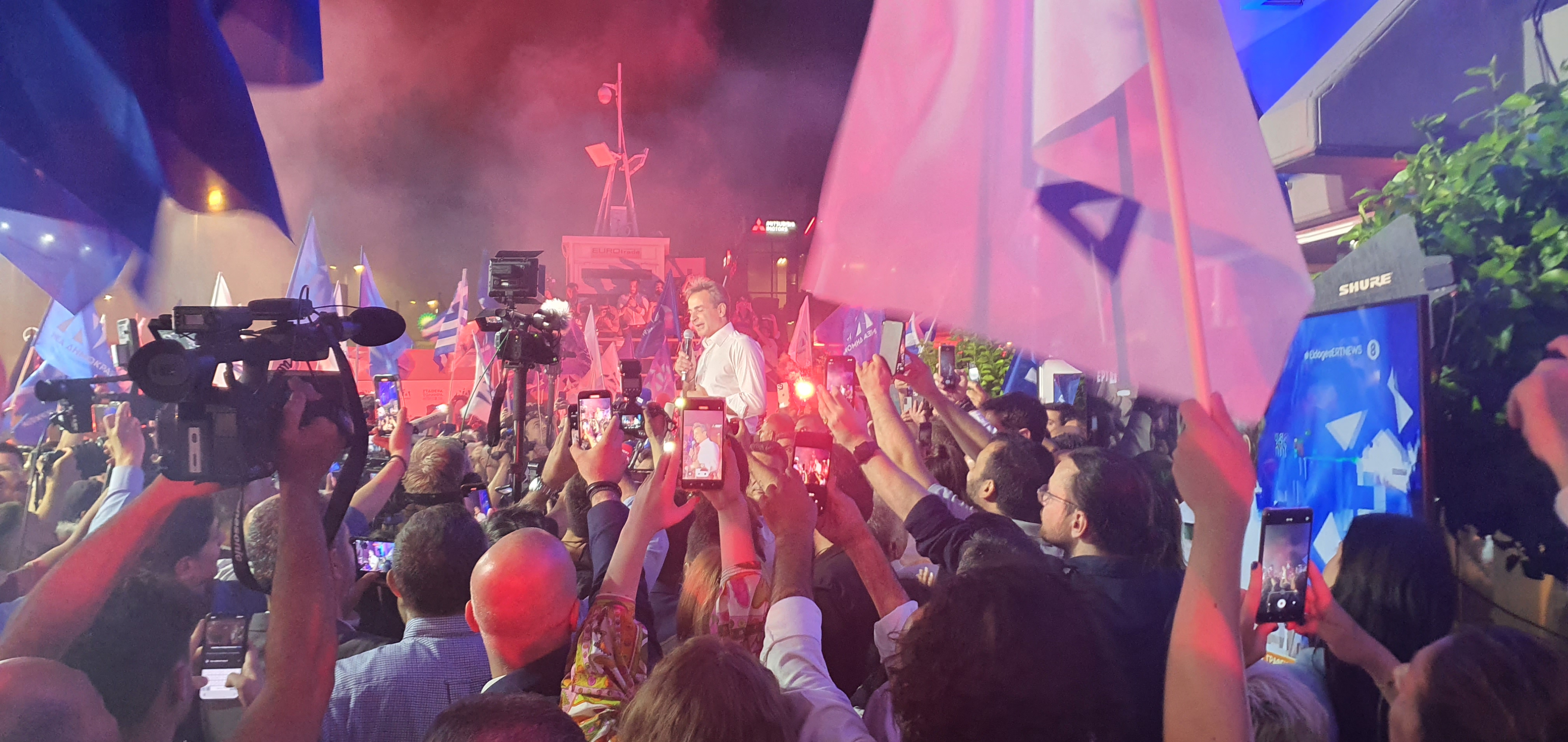 Greek Prime Minister-elect Kyriakos Mitsotakis addresses supporters outside party headquarters late on June 25, 2023 [John Psaropoulos/Al Jazeera]
