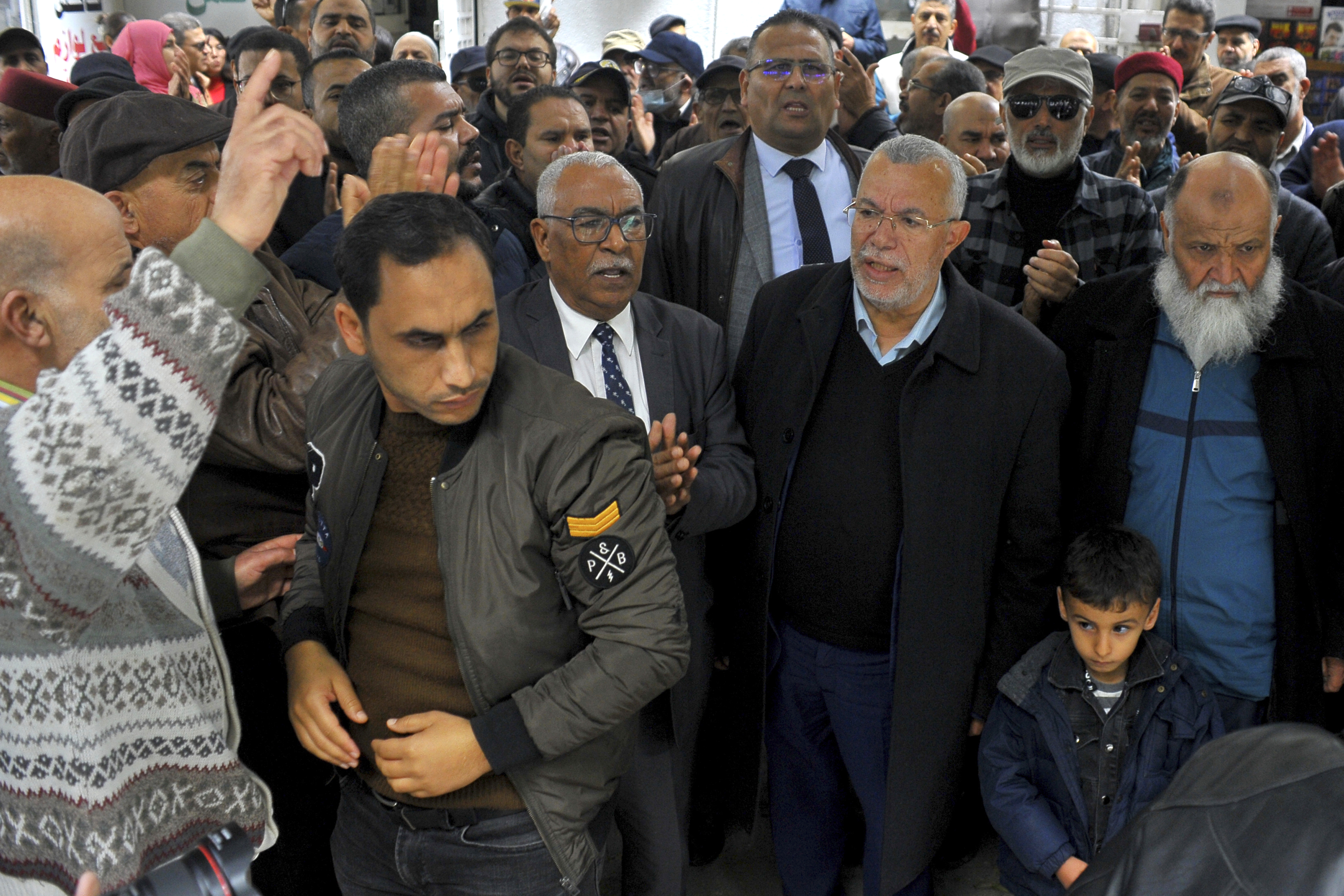 Supporters of Ennahdha stage a protest in front of the justice ministry to denounce the arrest of a senior leader