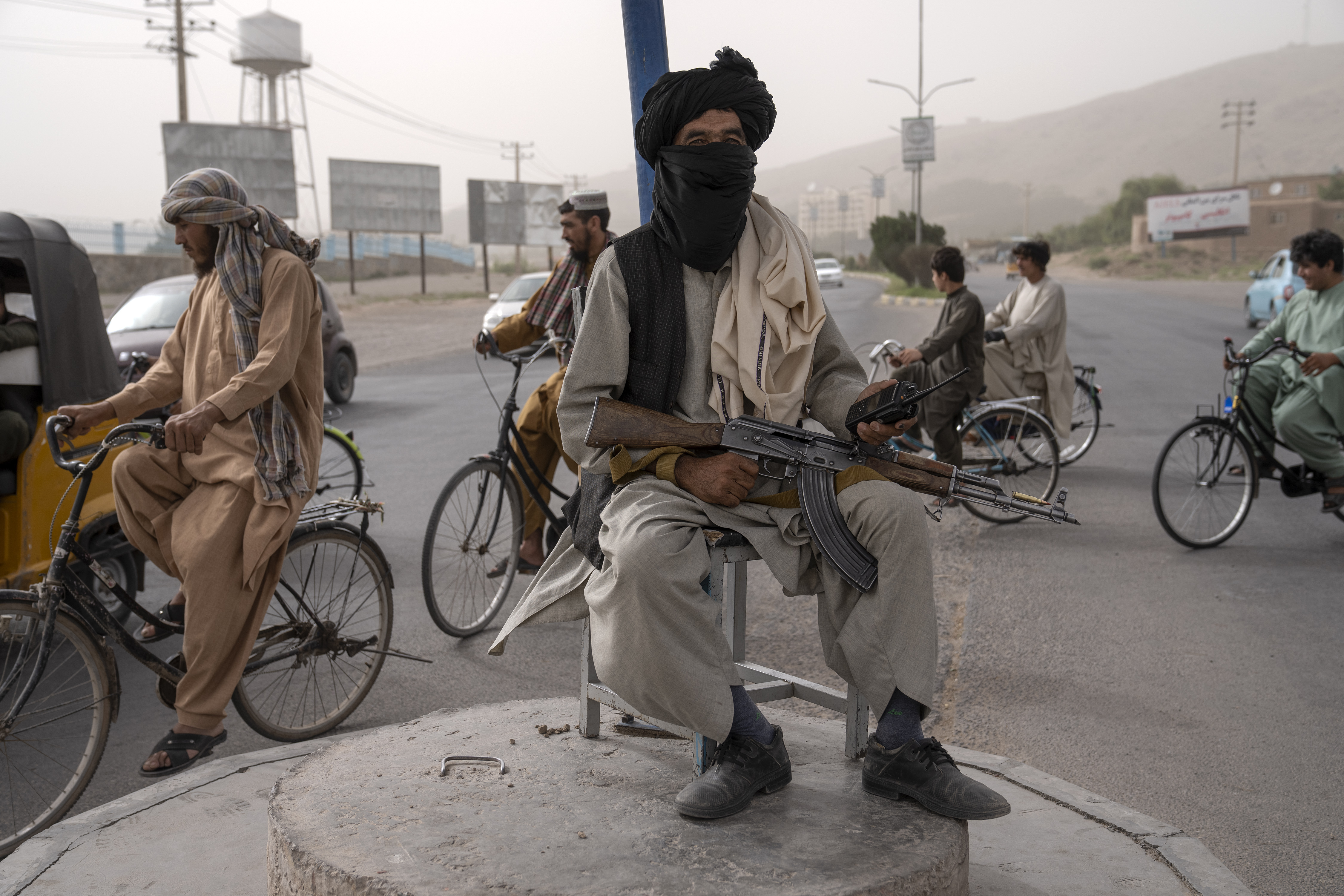 A Taliban fighter guards a street in Herat, Afghanistan