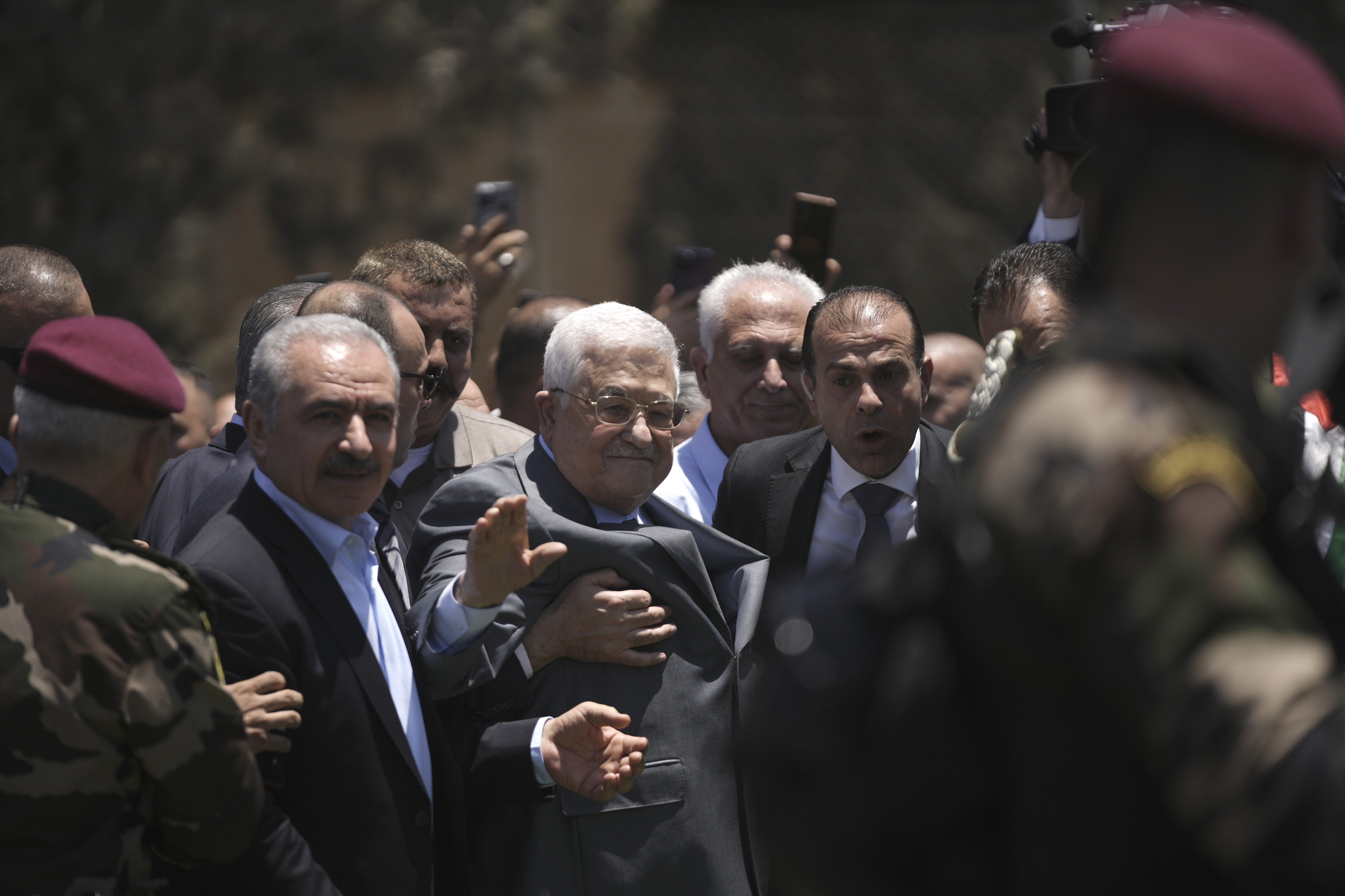 Palestinian President Mahmoud Abbas, center, visits the Jenin refugee camp in the West Bank