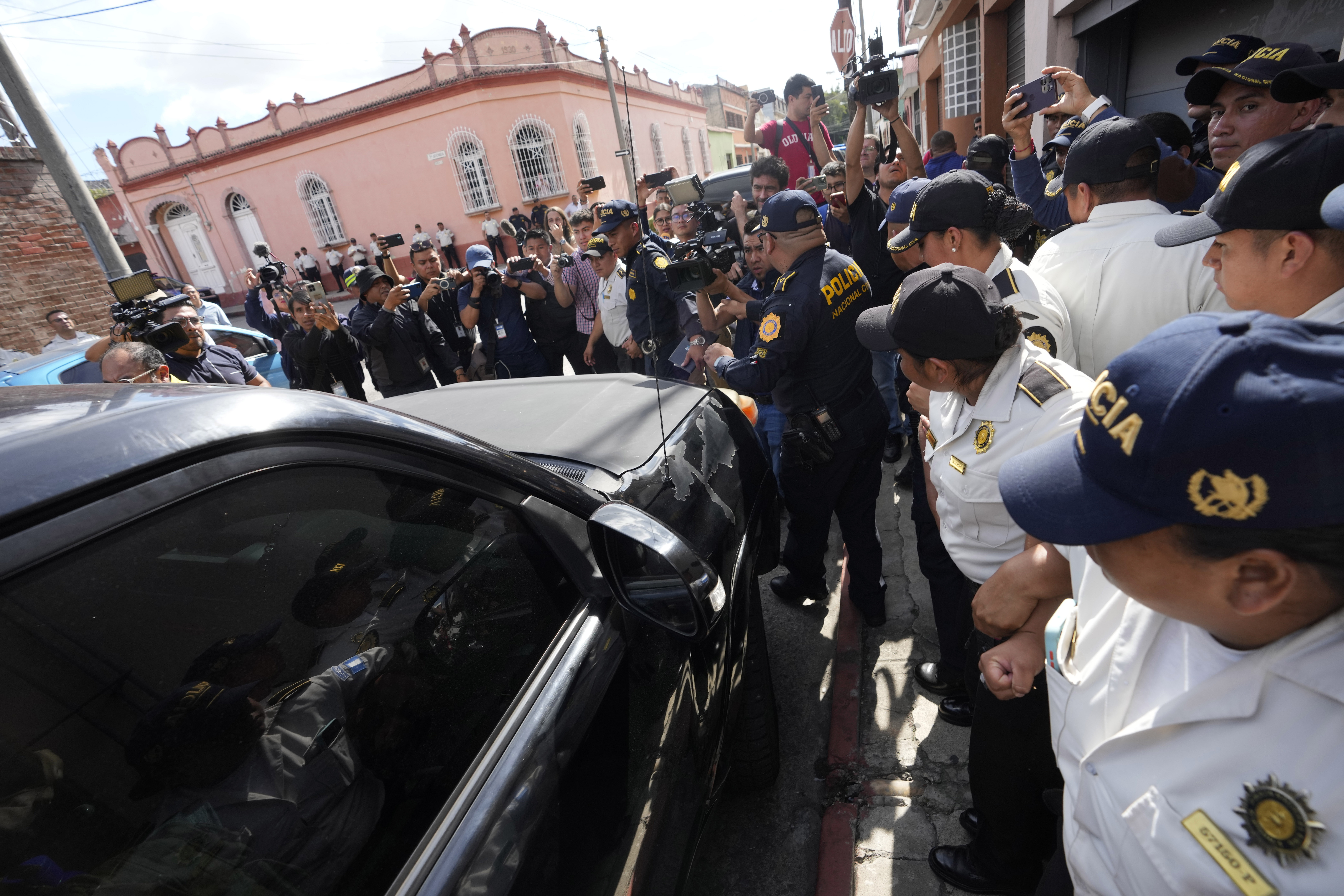 A vehicle carrying a government prosecutor protected by police