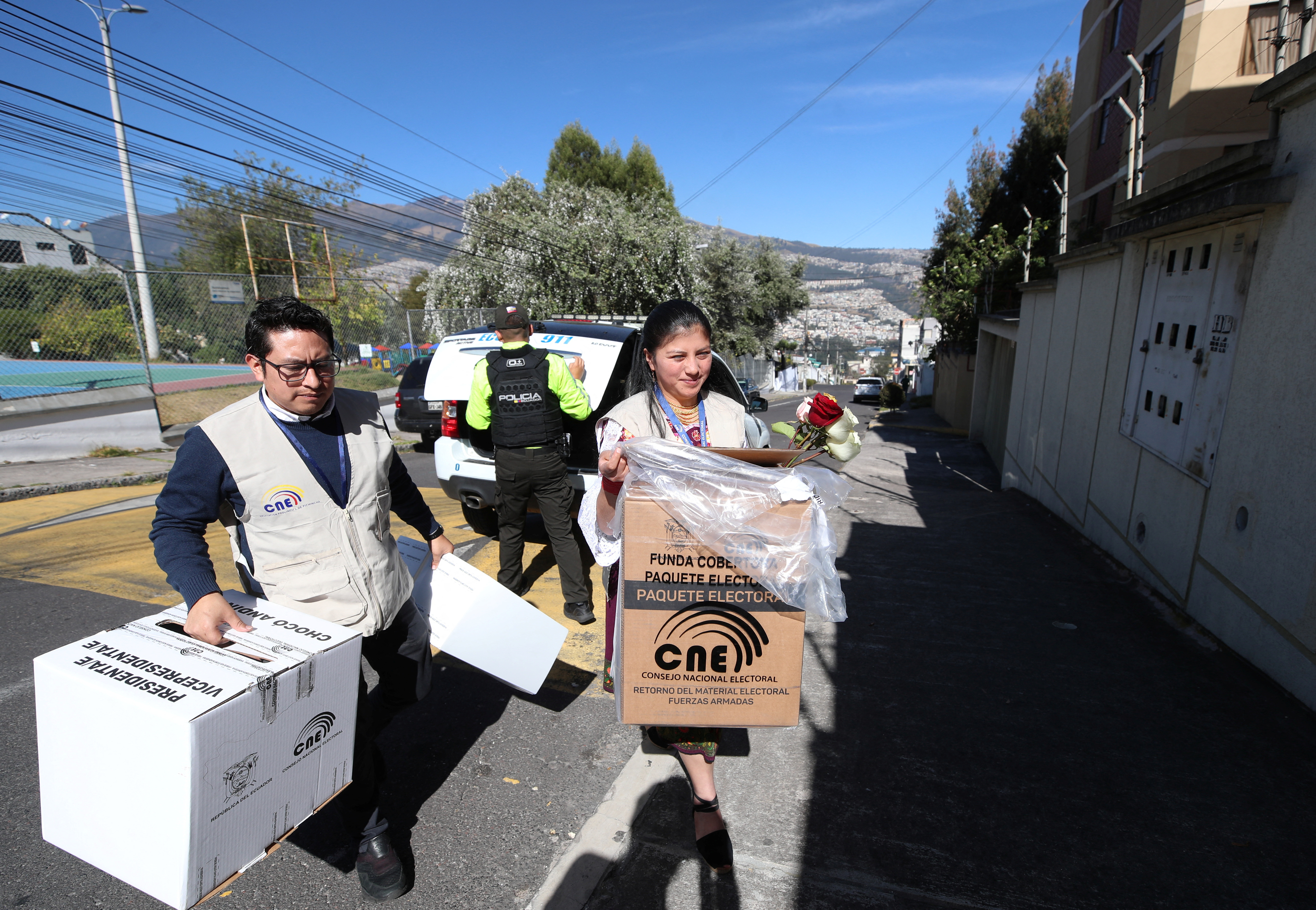 Officials of the National Electoral Council (CNE) take ballot boxes to homes for elderly to vote ahead of crucial Sunday's presidential election
