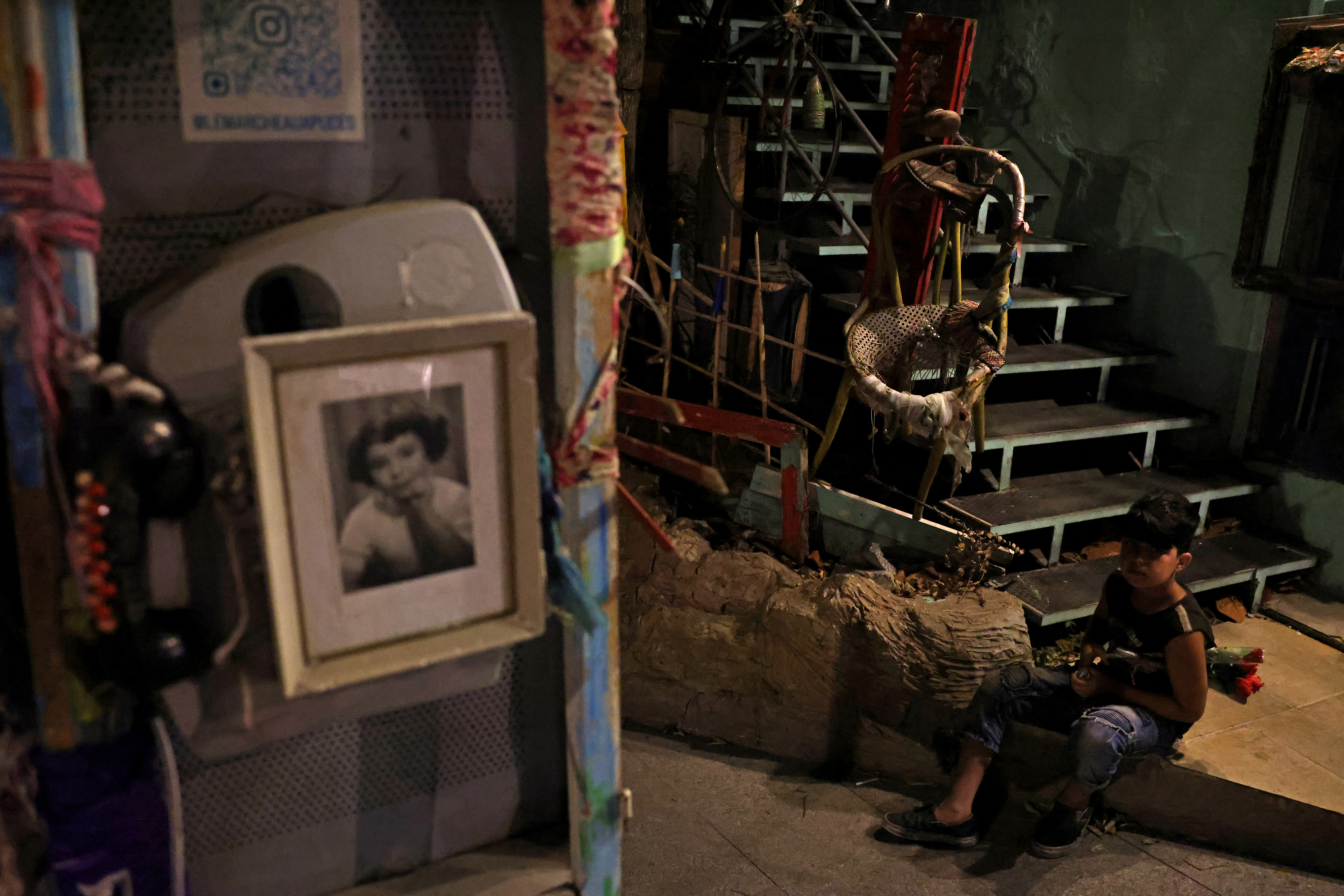 A boy sells flowers in the historic Gemmayzeh district, which had been badly damaged in Beirut's port blast