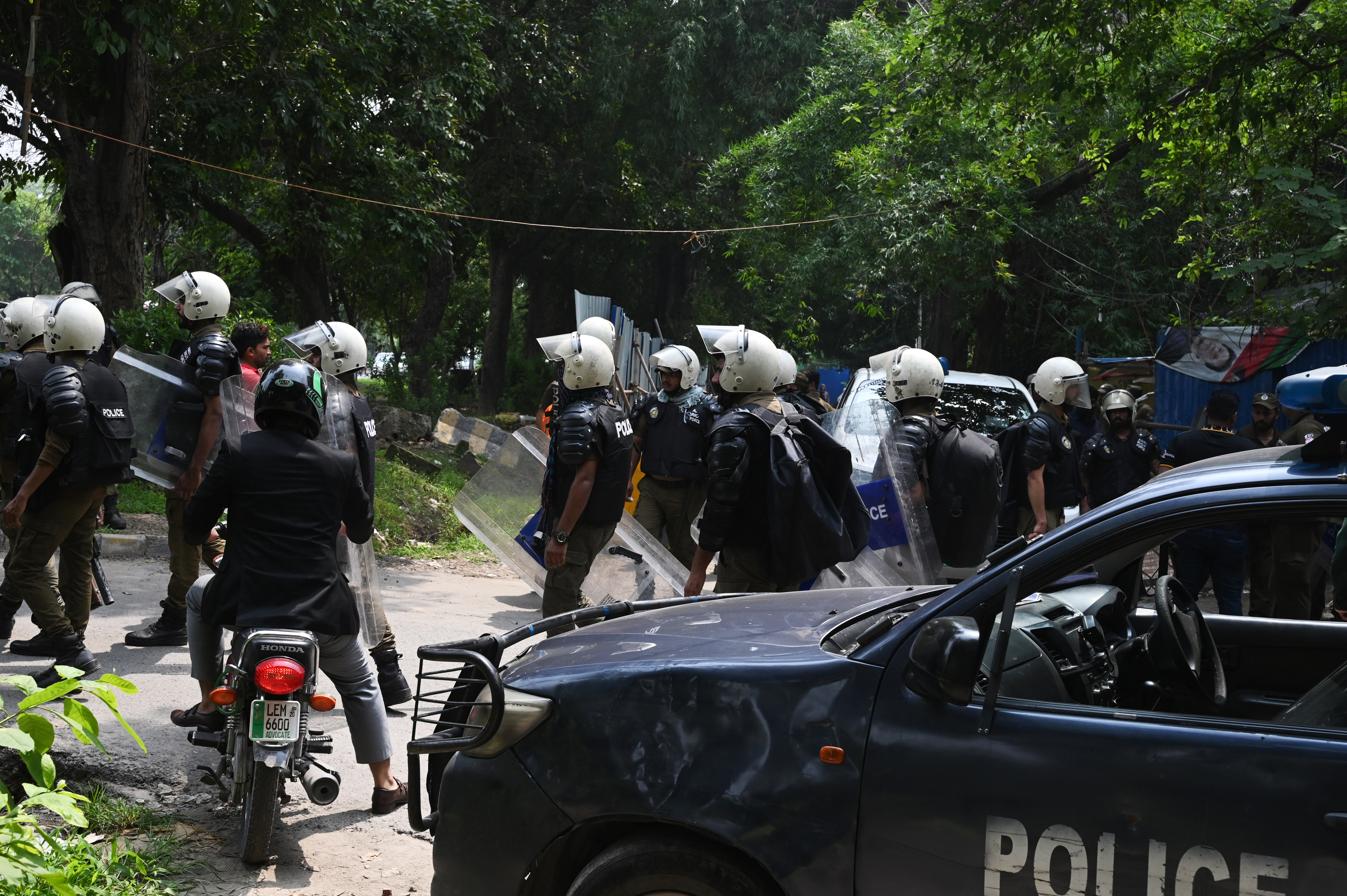 Pakistan police stand outside the house of former Pakistan prime minister Imran Khan after his arrest in Lahore