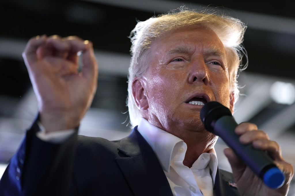 FILE - Republican presidential candidate former President Donald Trump speaks to supporters during a visit to the Iowa State Fair, Saturday, Aug. 12, 2023, in Des Moines, Iowa. Trump’s response this week to his fourth criminal indictment in five months follows a strategy he has used for years against legal and political opponents: relentless attacks, often infused with language that is either overtly racist or is coded in ways that appeal to racists. (AP Photo/Charlie Neibergall, File)