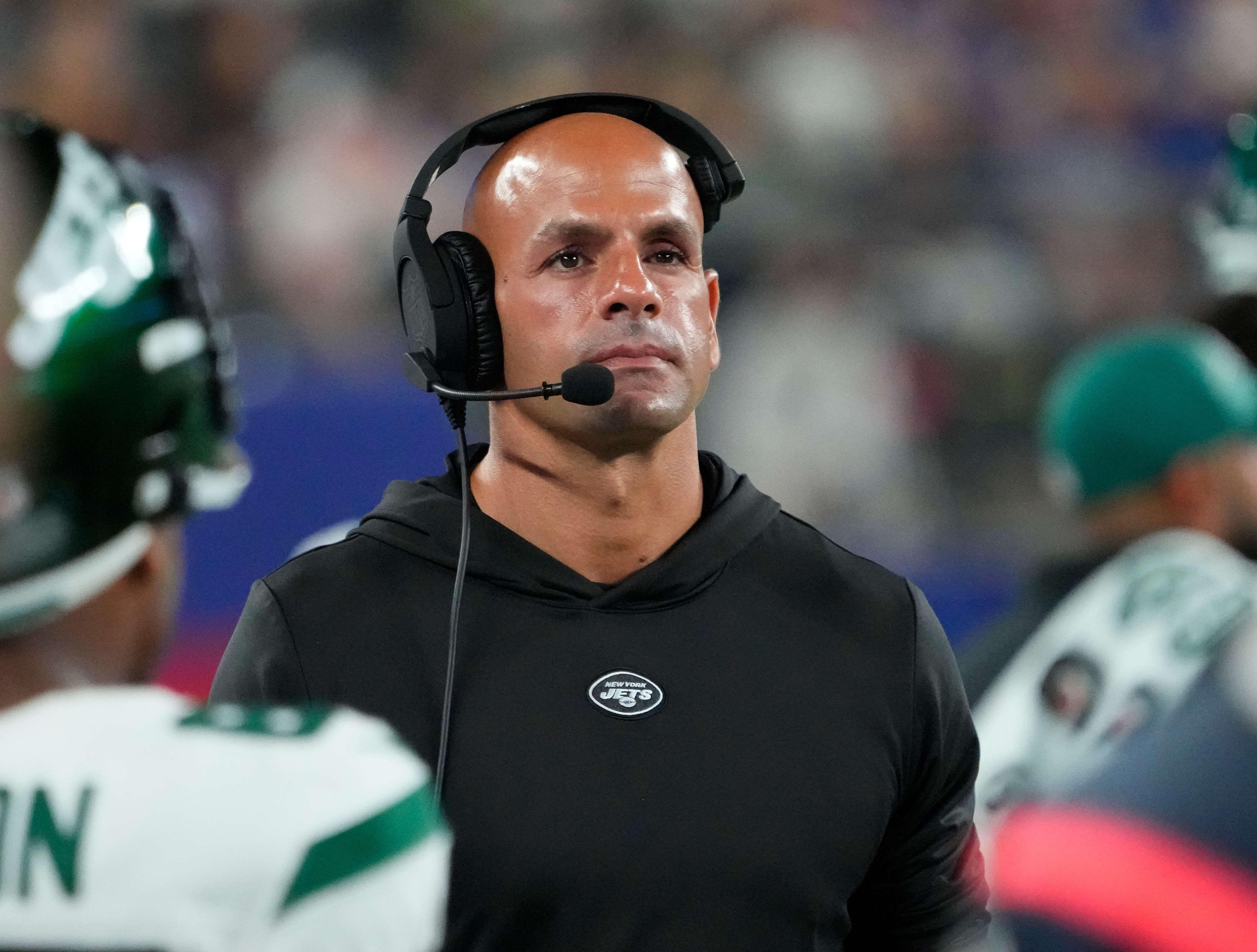 NY Jets head coach Robert Saleh wearing a headset during a game