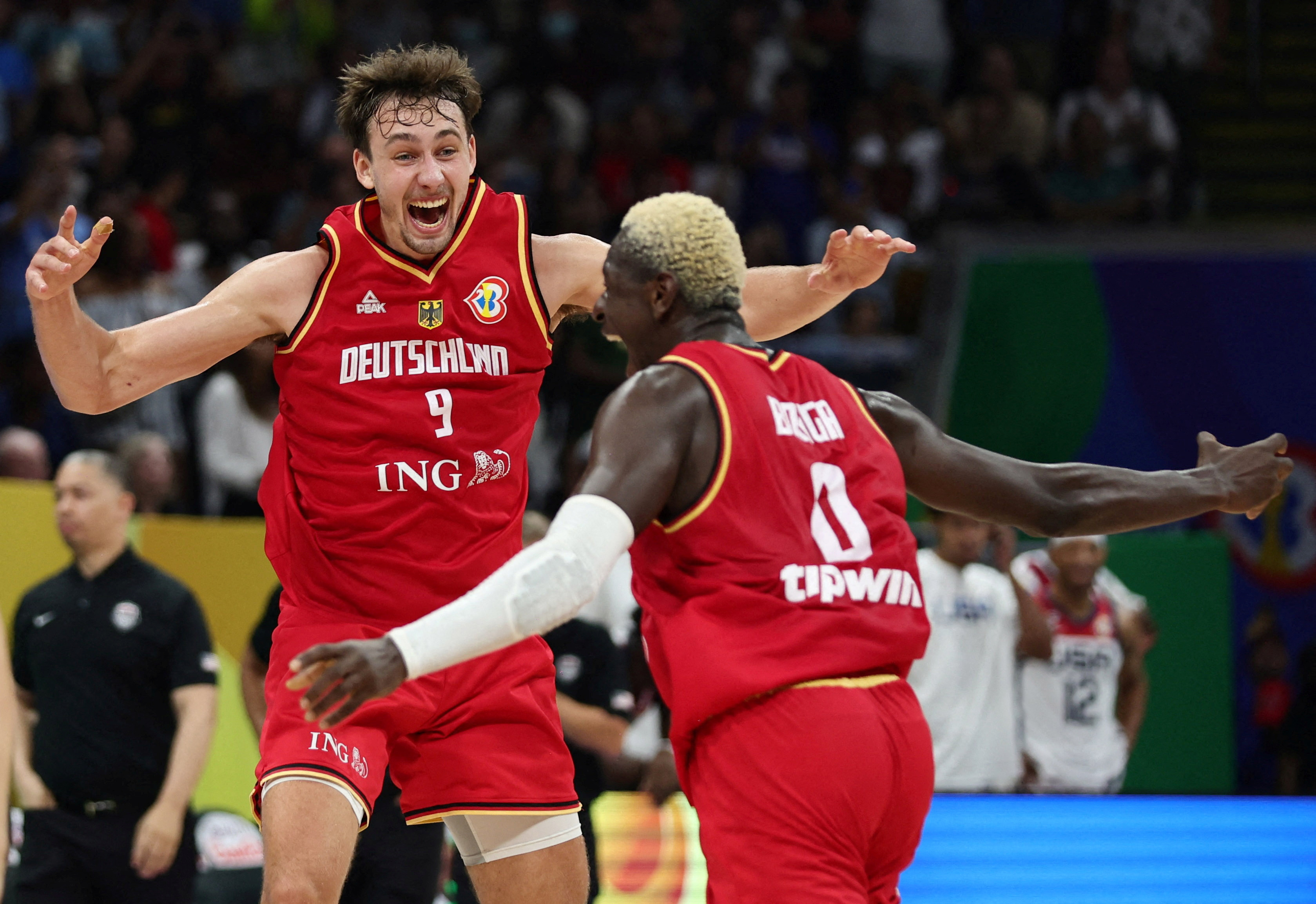 Germany's Franz Wagner and Isaac Bonga celebrate after the match