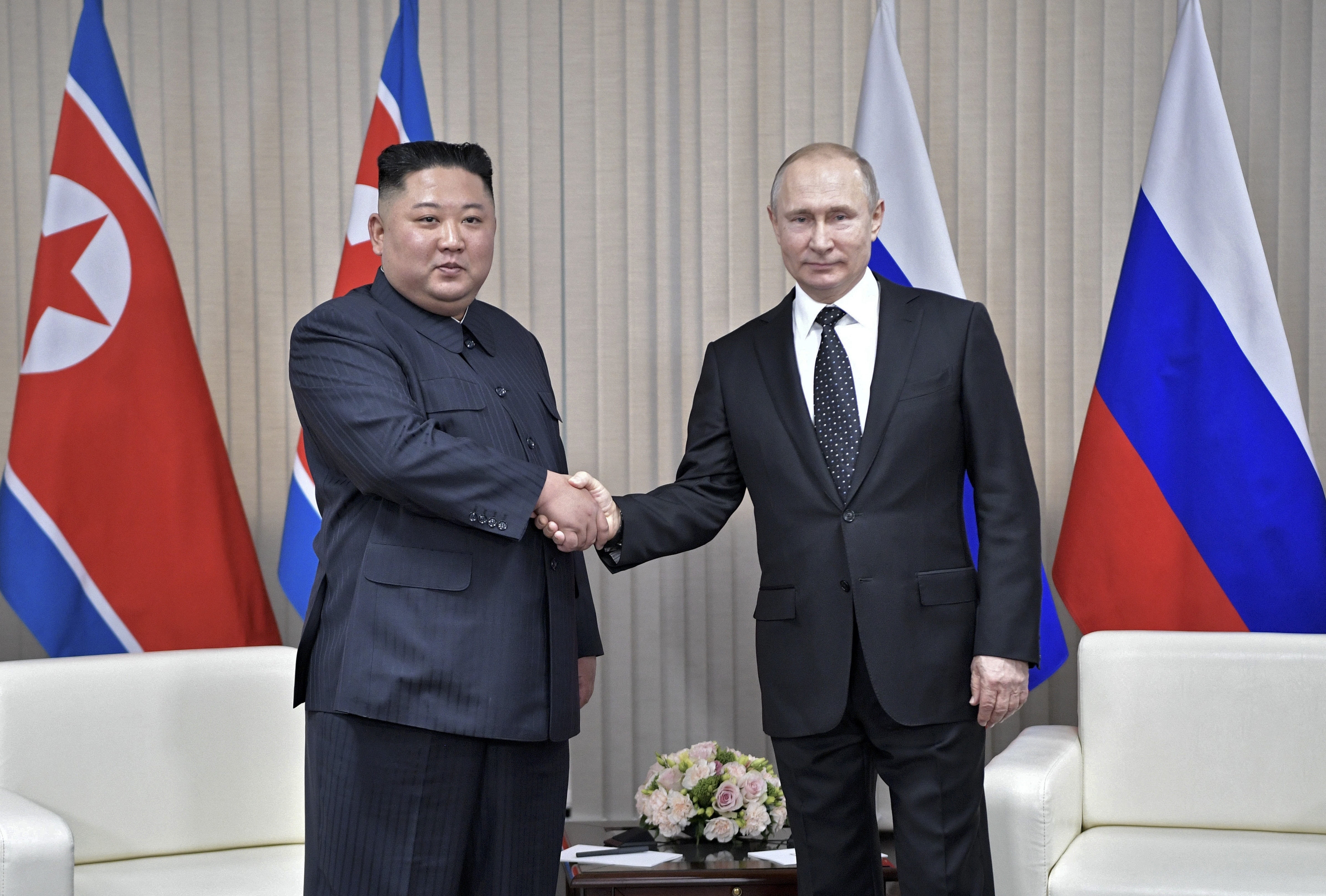 Russian President Vladimir Putin, right, and North Korea's leader Kim Jong Un