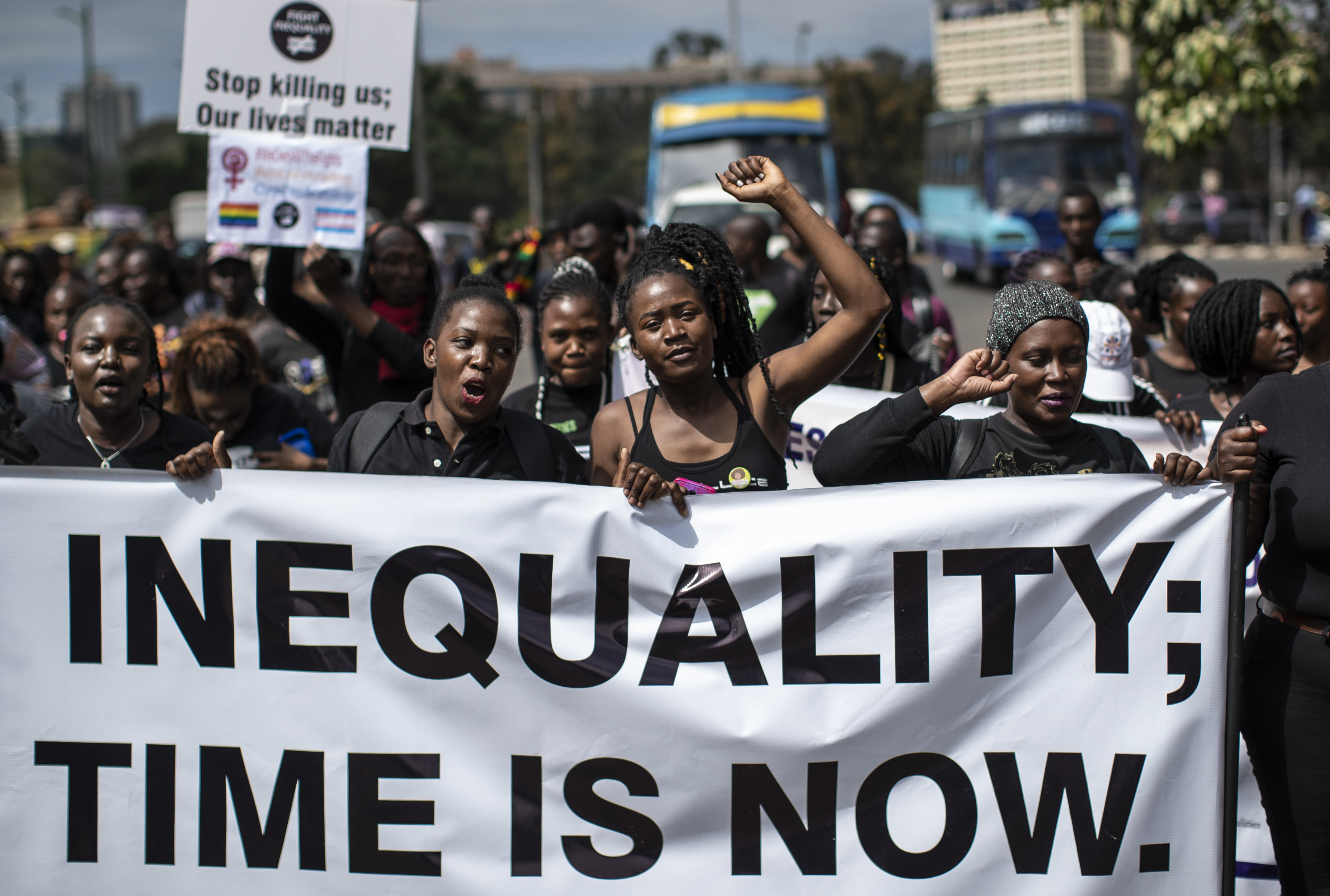 Demonstrators against inequality march to the office of the president in downtown Nairobi, Kenya Friday, Jan. 17, 2020. The march kicks off a week of planned global protests aimed at calling for an end to the "age of greed" and demanding fairer solutions to inequality, climate change, debt, taxation and other economic and human rights issues ahead of the World Economic Forum which is due to take place in Davos, Switzerland from Jan. 21-24. (AP Photo/Ben Curtis)