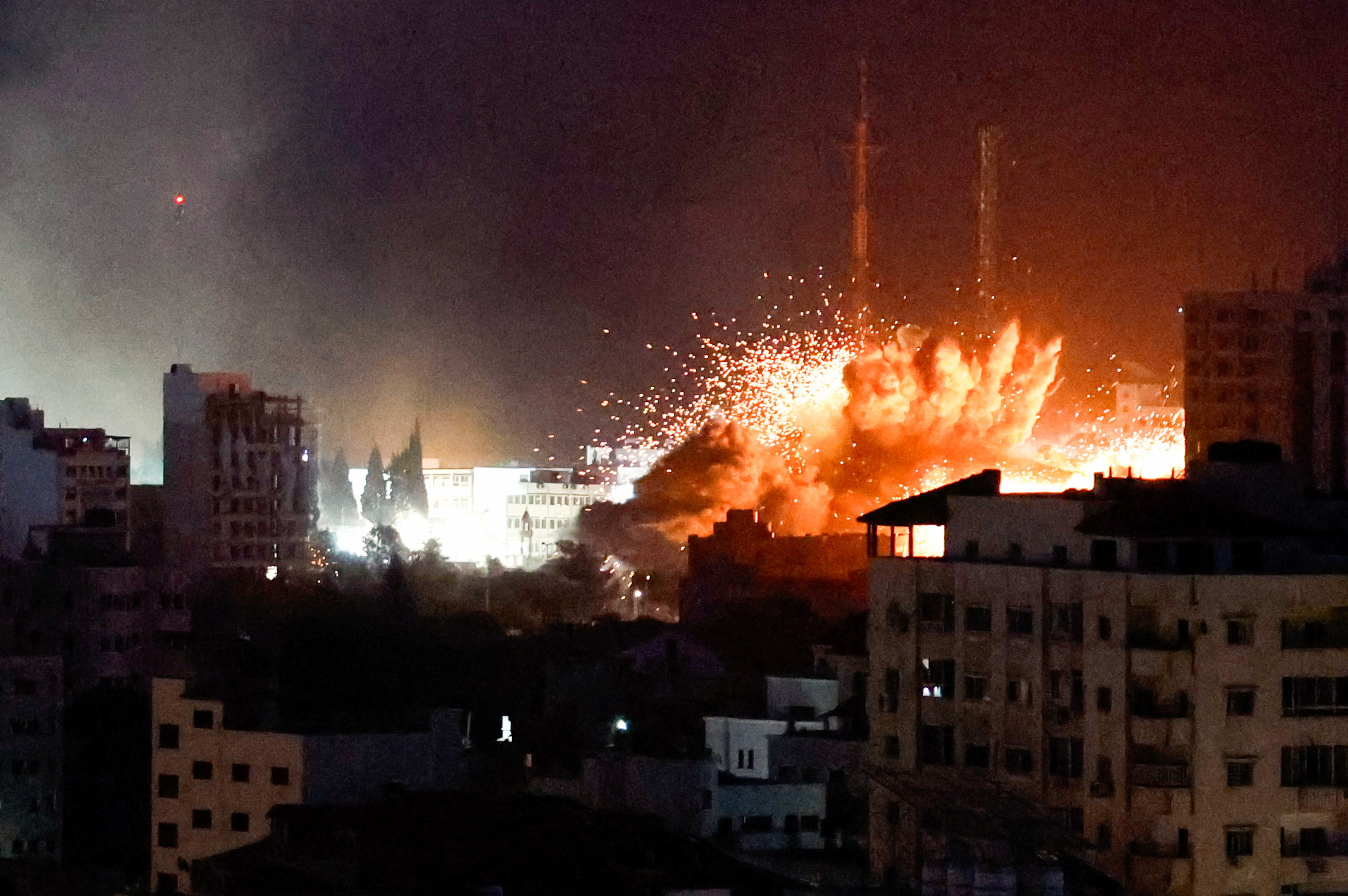 Flames and smoke billow during Israeli strikes in Gaza