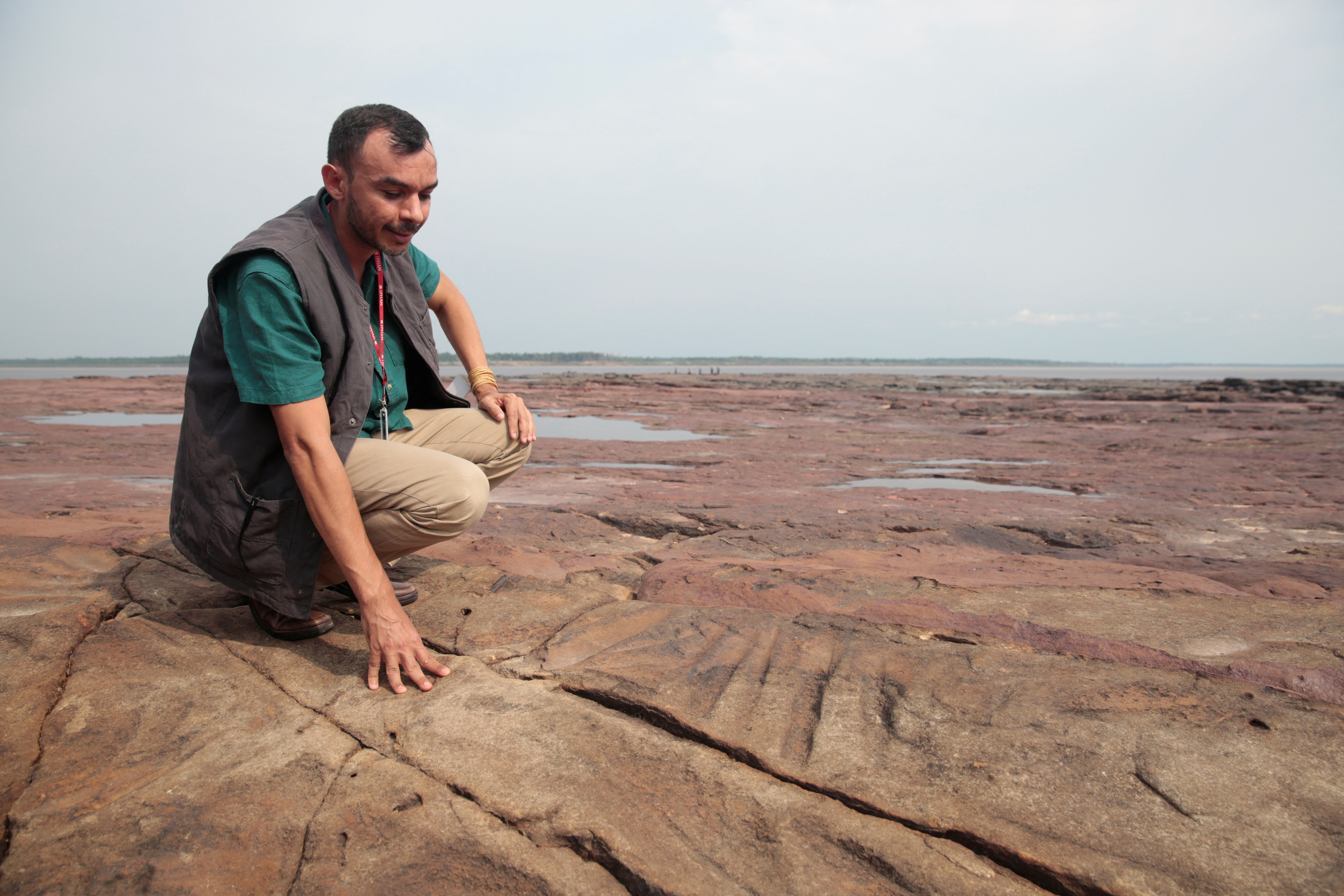 A view of ancient stone carvings on a rocky point of the Amazon river