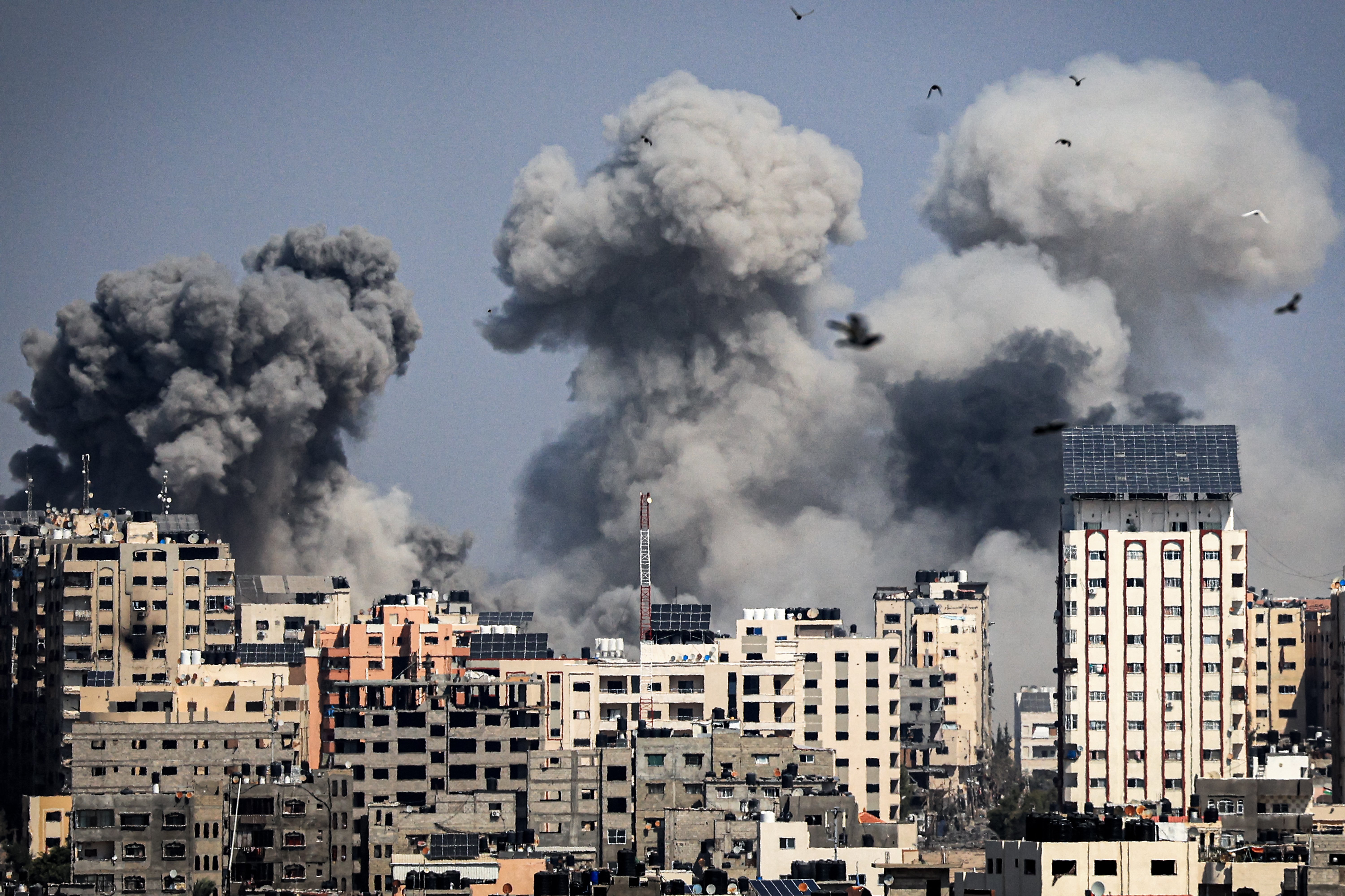 Smoke plumes billow during Israeli air strikes in Gaza City