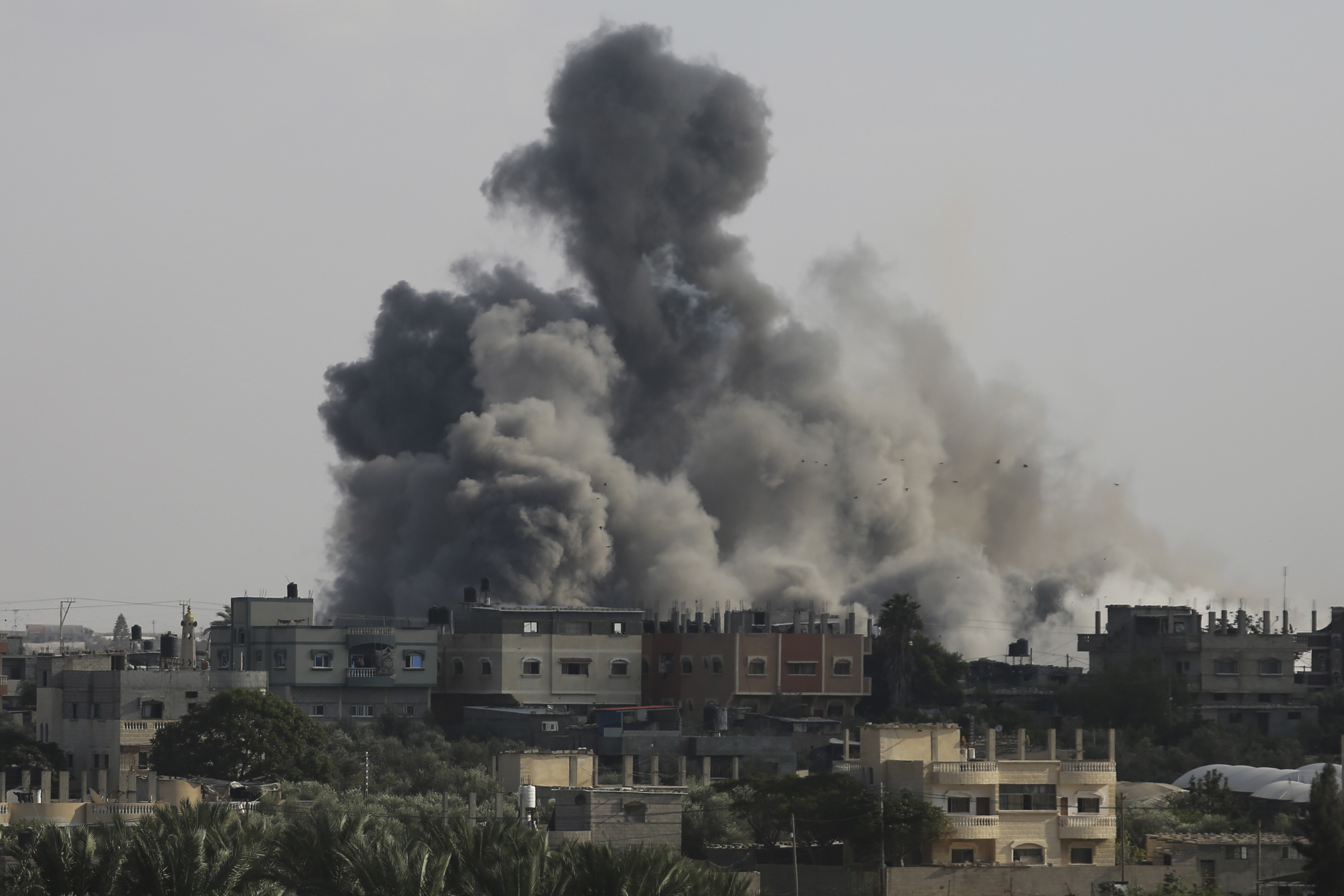 Smoke rises from an explosion caused by Israeli airstrikes on the border between Egypt and Rafah, Gaza Strip