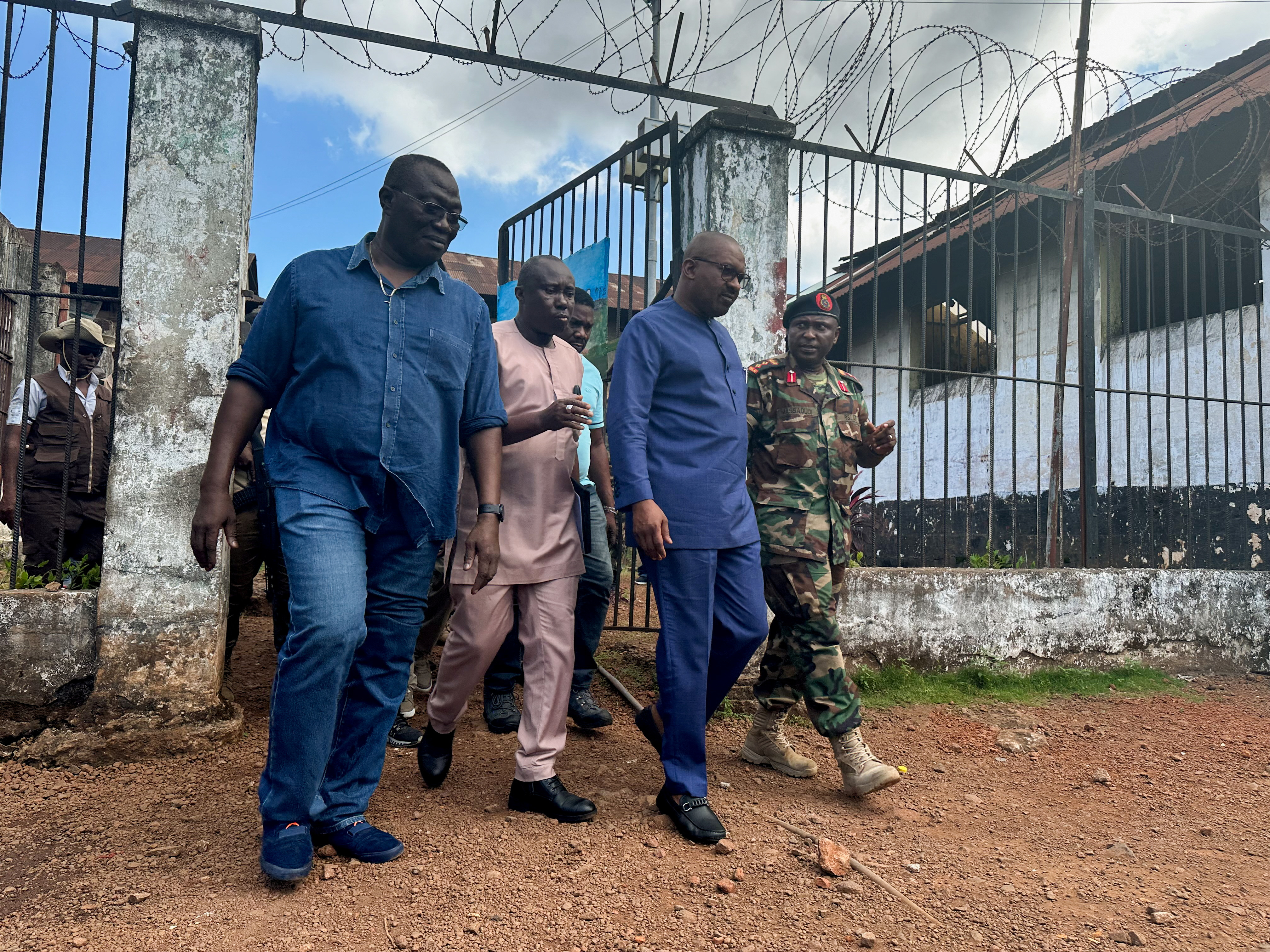 A government official visits a prison that came under attack by gunmen