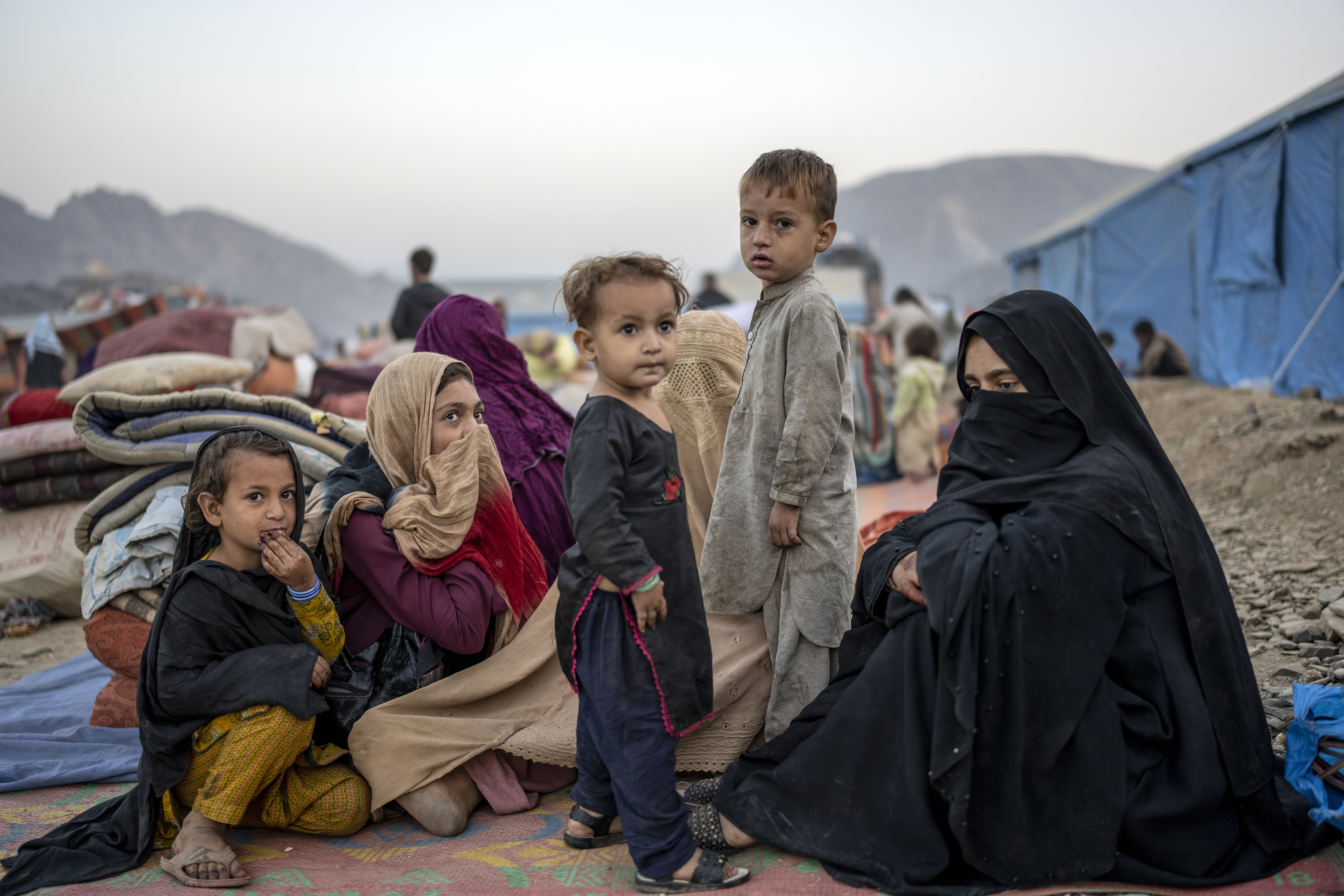 Afghan refugees settle in a camp near the Torkham Pakistan-Afghanistan border in Torkham, Afghanistan, Saturday.