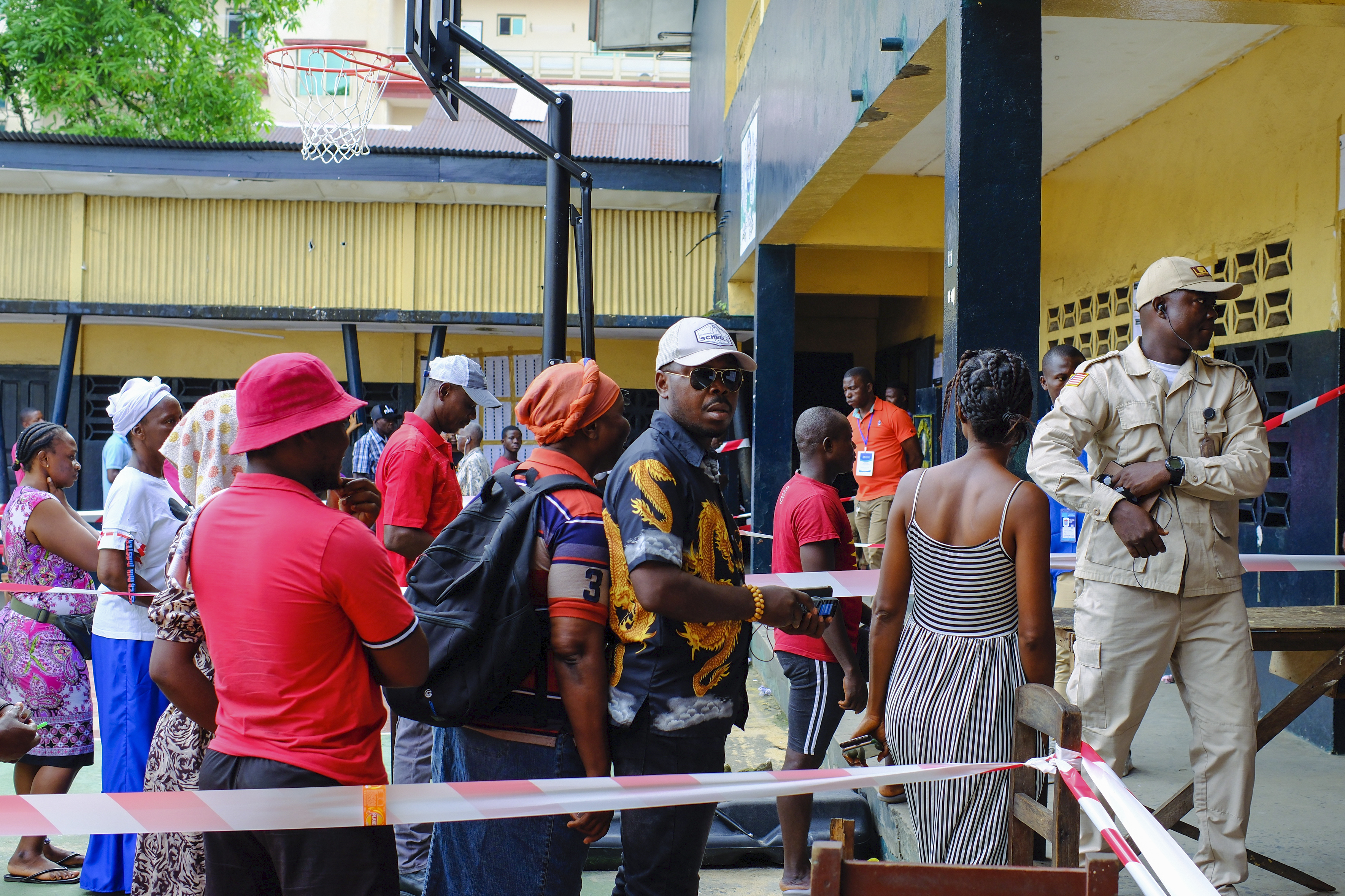 Voters line up outside a polling station for the second round of the presidential election in Monrovia, Liberia, on November 14, 2023 [AP Photo/Rami Malek]