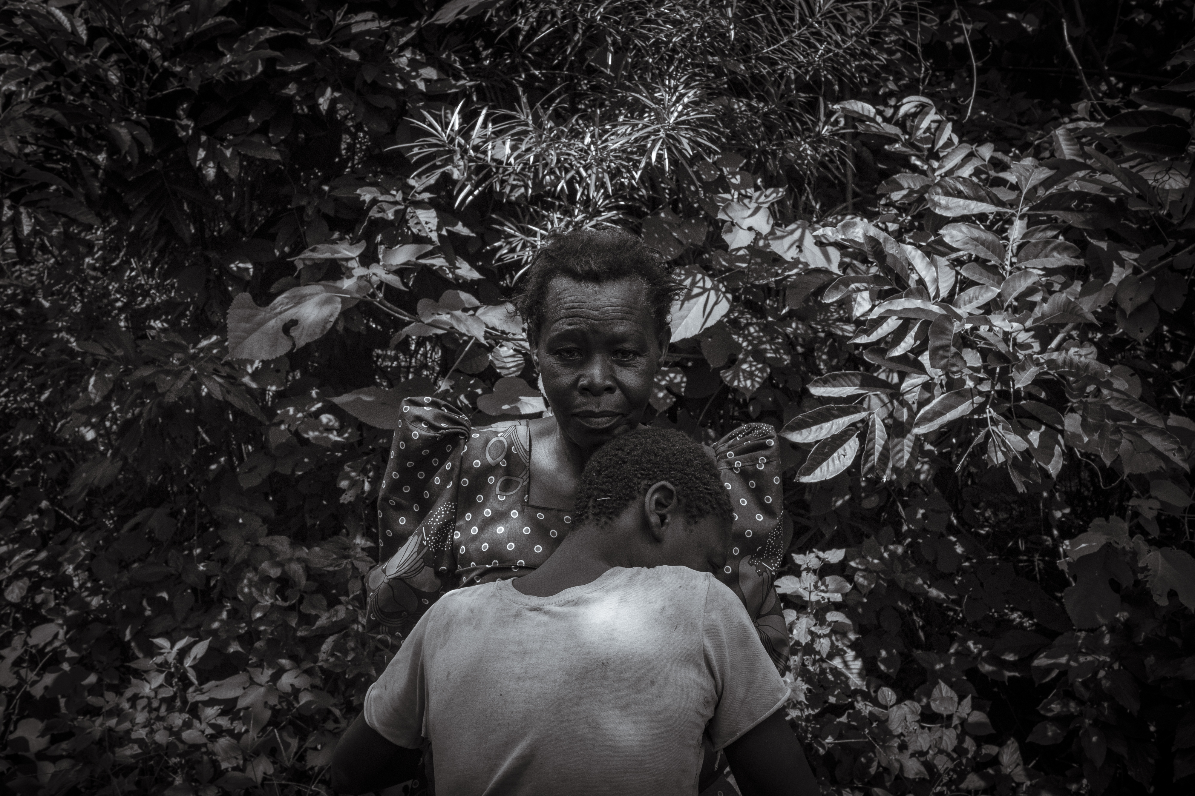 Perez Mbwase cuddles into his mother Lovinsa Namwebya