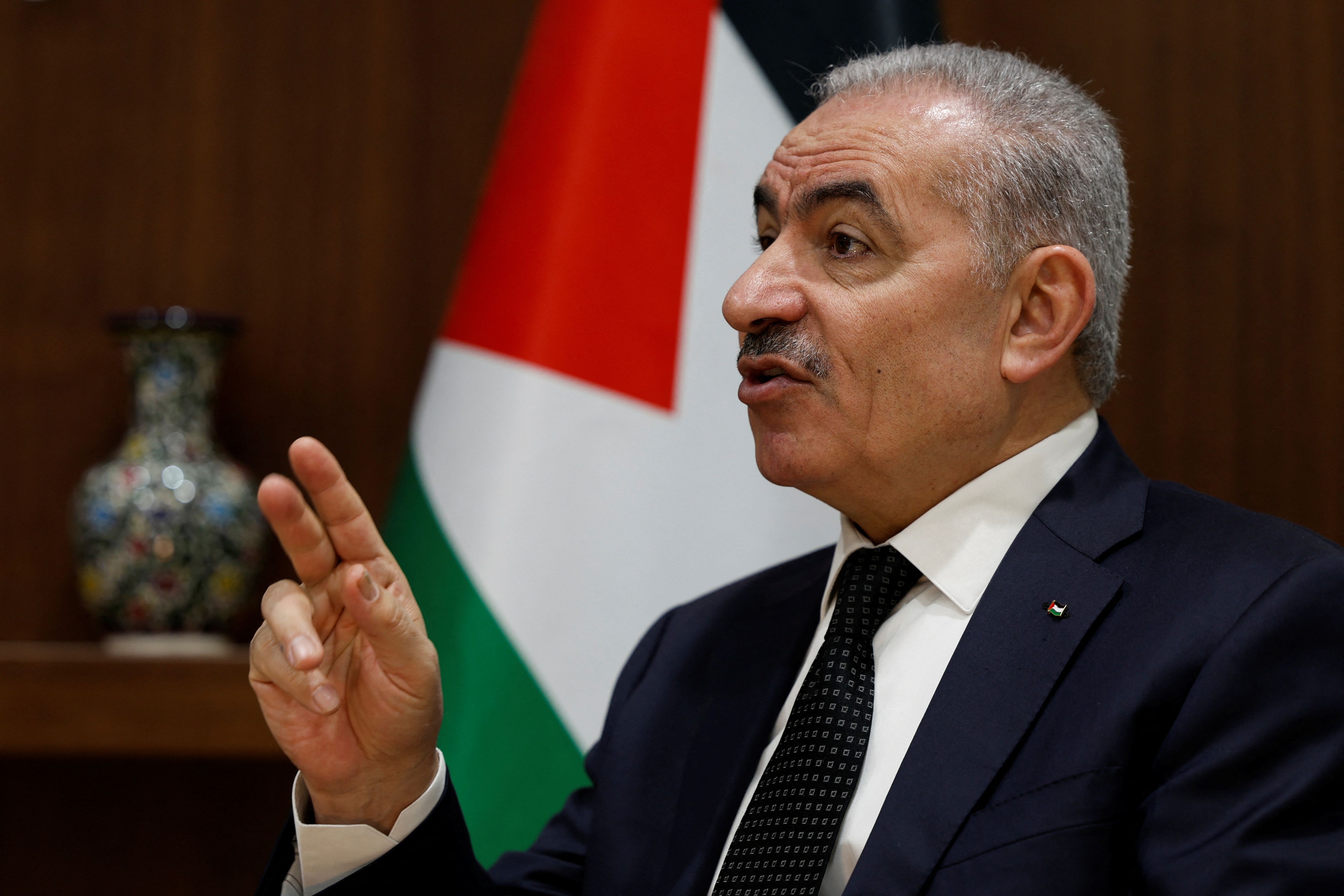 Palestinian Prime Minister Mohammad Shtayyeh speaks to Reuters at his office in Ramallah