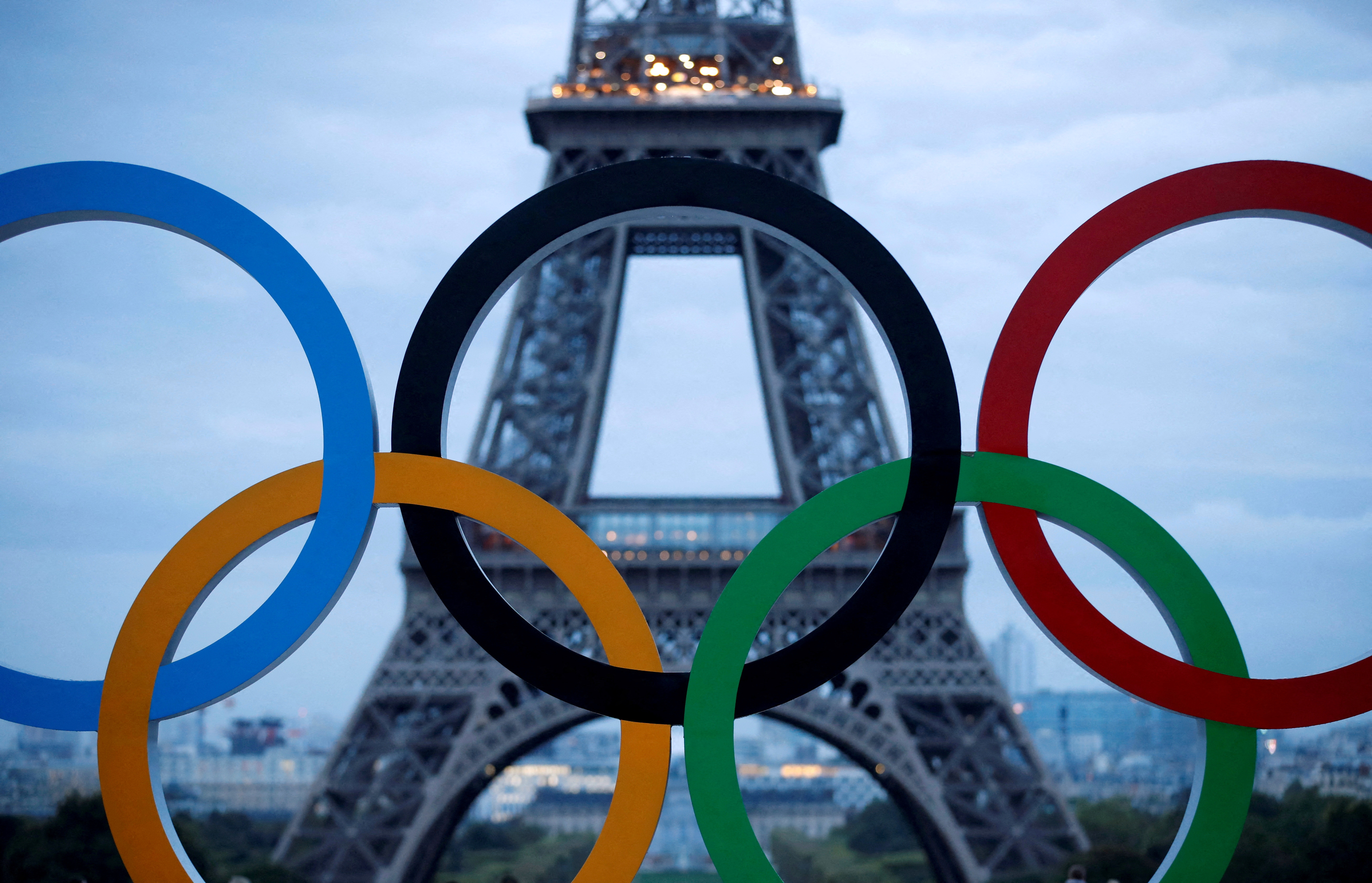 FILE PHOTO: Olympic rings to celebrate the IOC official announcement that Paris won the 2024 Olympic bid are seen in front of the Eiffel Tower at the Trocadero square in Paris, France, September 14, 2017. REUTERS/Christian Hartmann/File Photo/File Photo