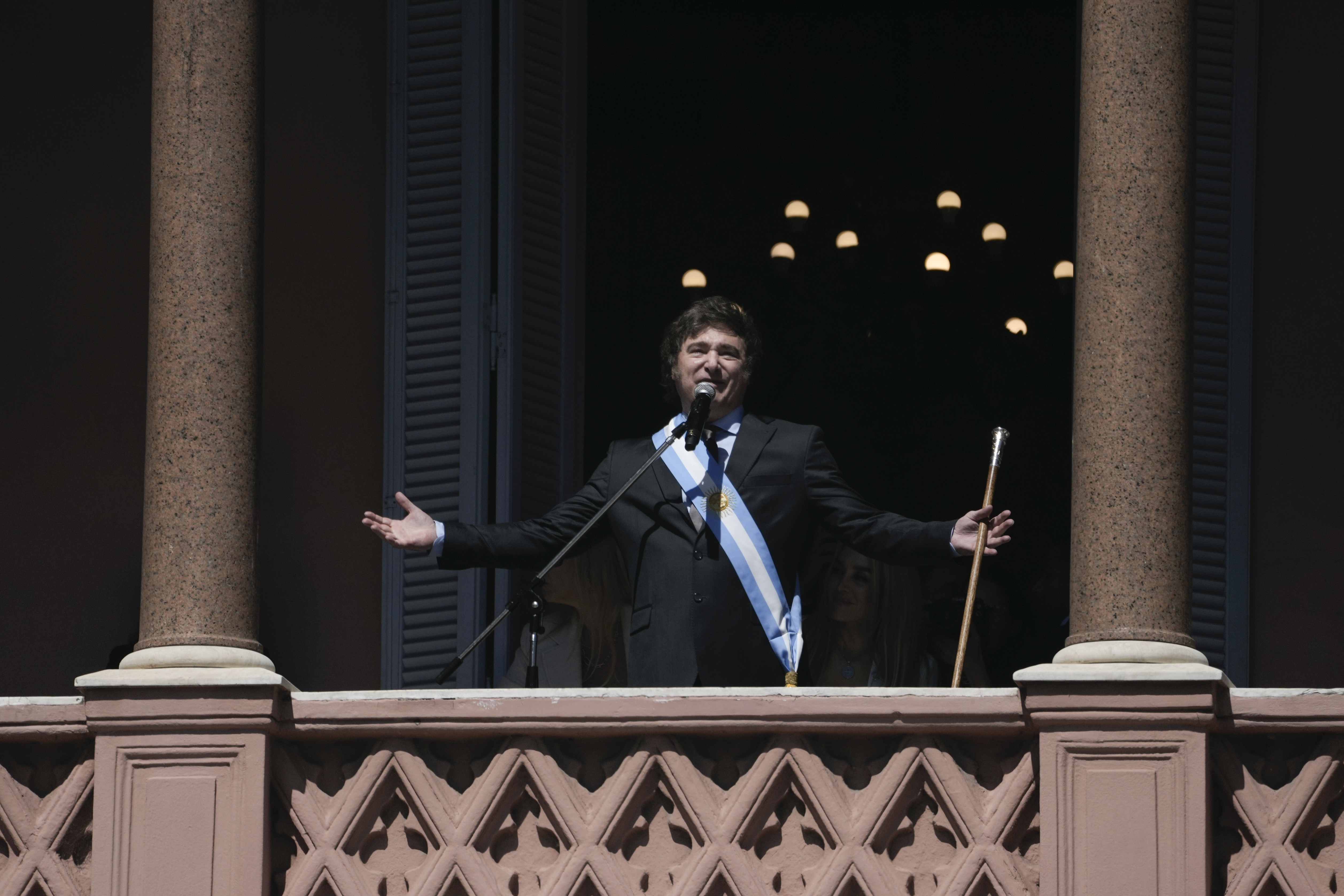 Argentina&#039;s newly sworn-in President Javier Milei addresses supporters from the balcony of the government house in Buenos Aires, Argentina, Sunday, Dec. 10, 2023. [AP Photo/Rodrigo Abd]