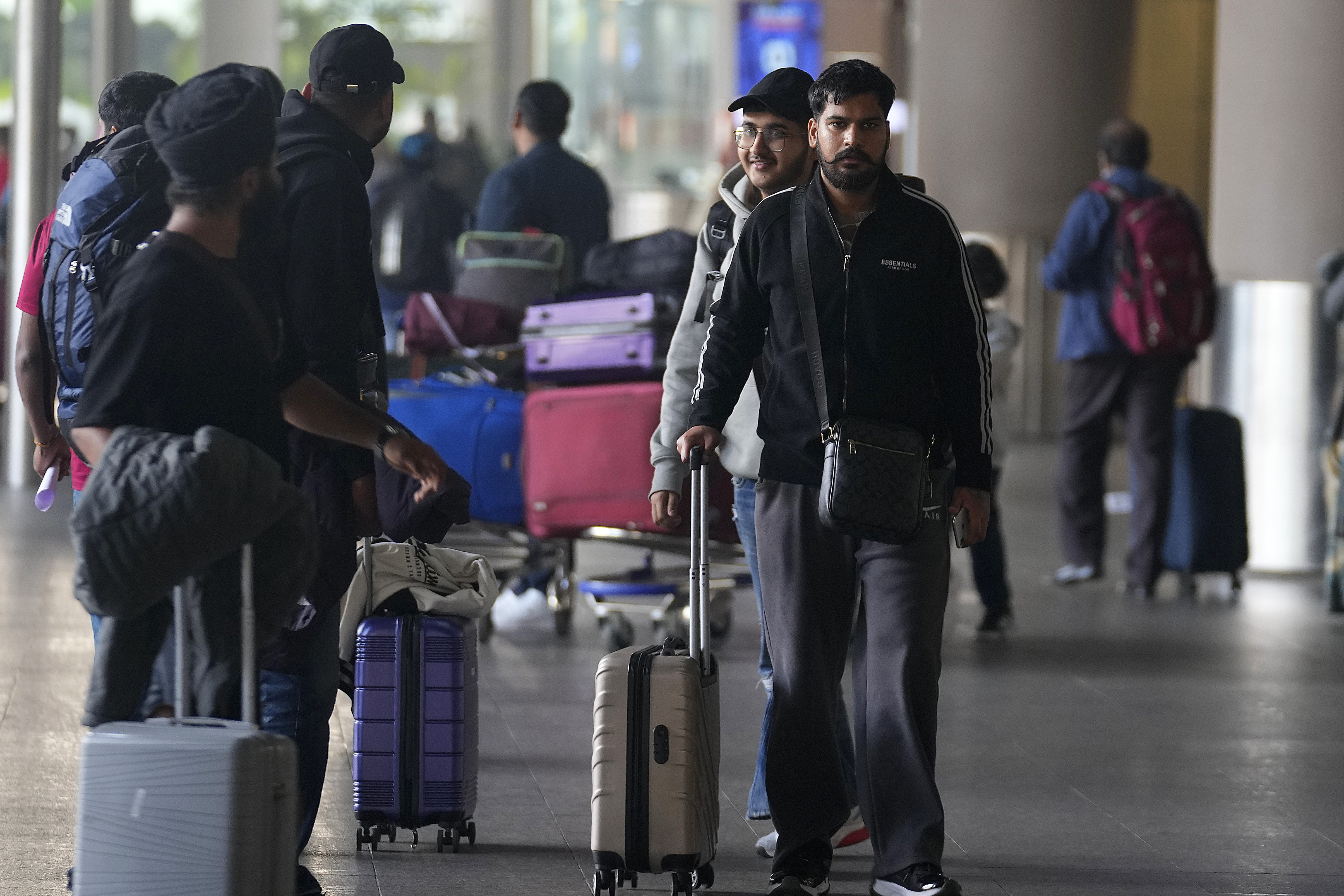 The flight en route to Nicaragua from the United Arab Emirates was stopped in France for four days before most of its Indian passengers were sent home and landed in Mumbai on December 26, 2023 [Rafiq Maqbool/AP Photo]