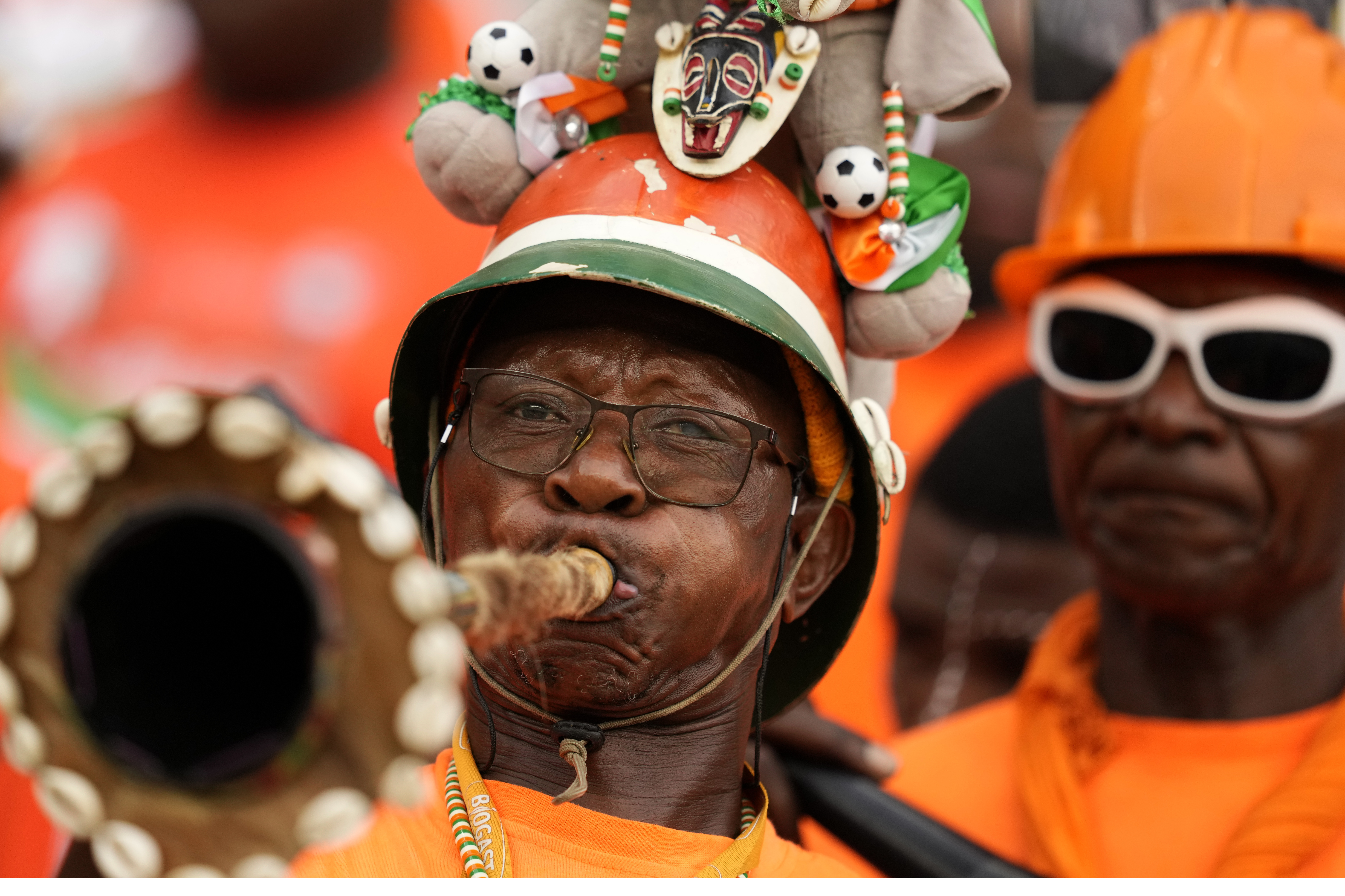 Ivorian fans wait fir the star of the African Cup of Nations Group A soccer match between Ivory Coast and Guinea-Bissau in Abidjan, Ivory Coast, Saturday, Jan. 13, 2024. (AP Photo/Sunday Alamba)
