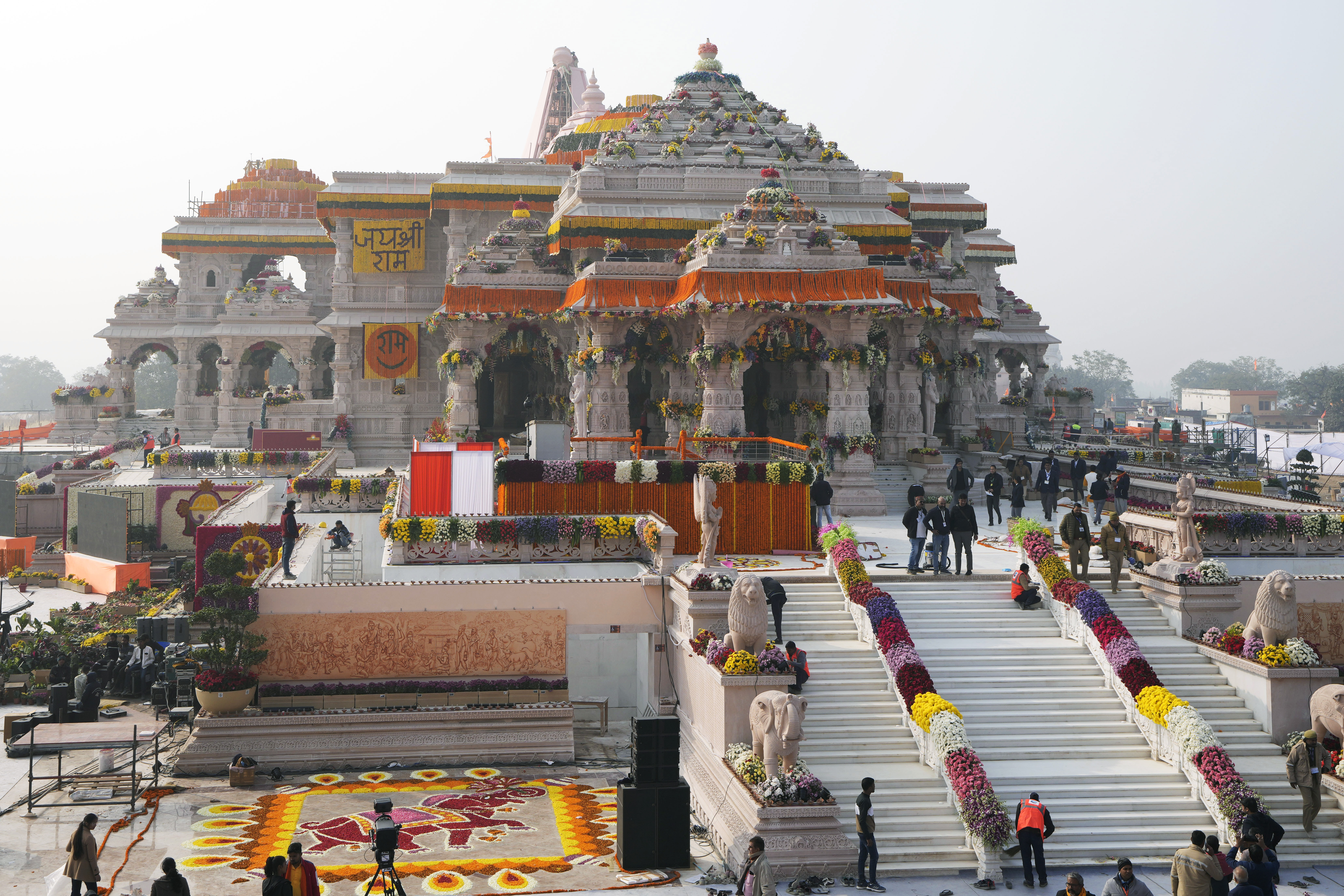 The compound and the building of a temple dedicated to Hindu deity Lord Ram are decorated with flowers the day before the temple's grand opening in Ayodhya, India, Sunday, Jan. 21, 2024. (AP Photo/Rajesh Kumar Singh)