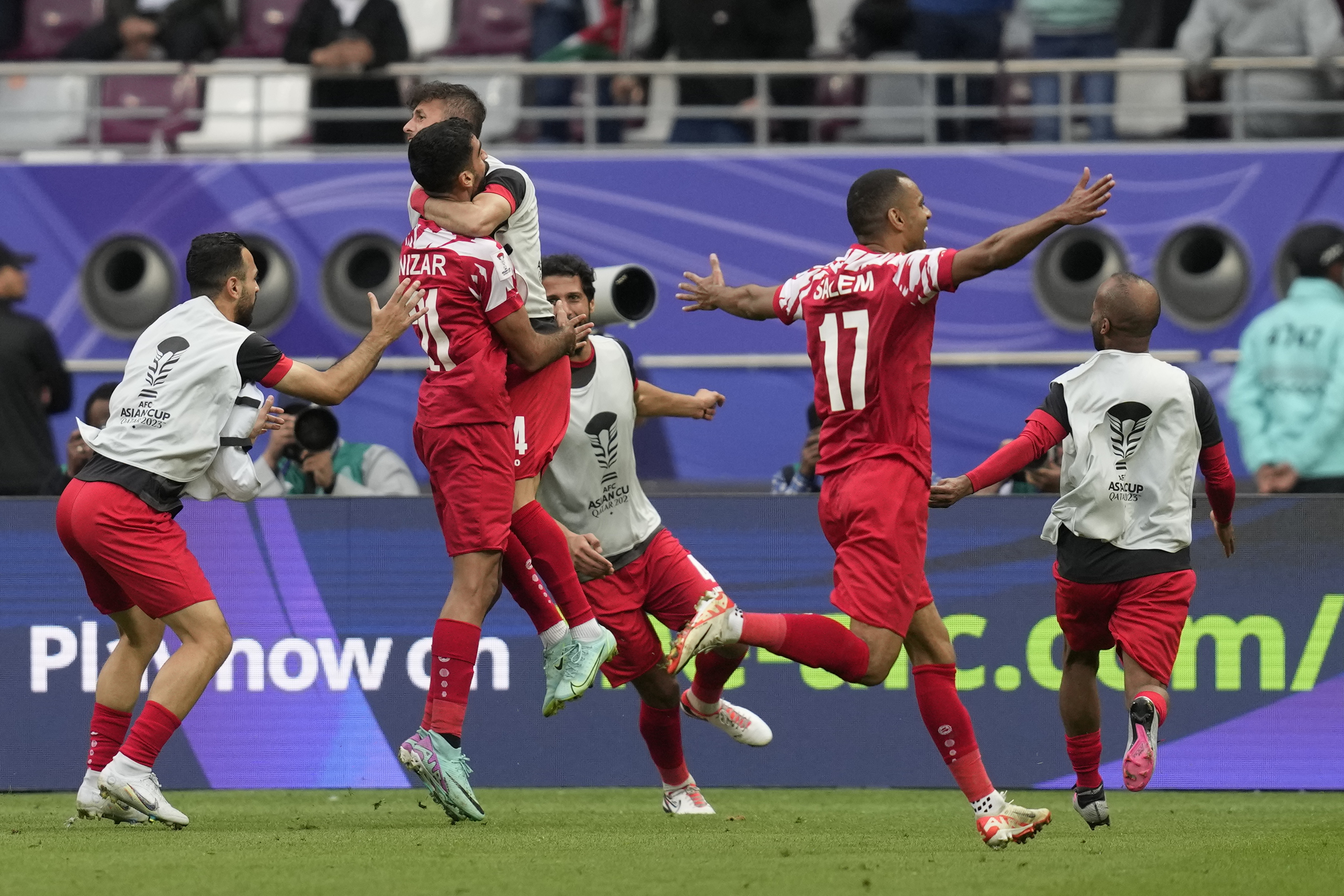 Jordan's Nizar Alrashdan, second left, celebrates after scoring his side's third goal