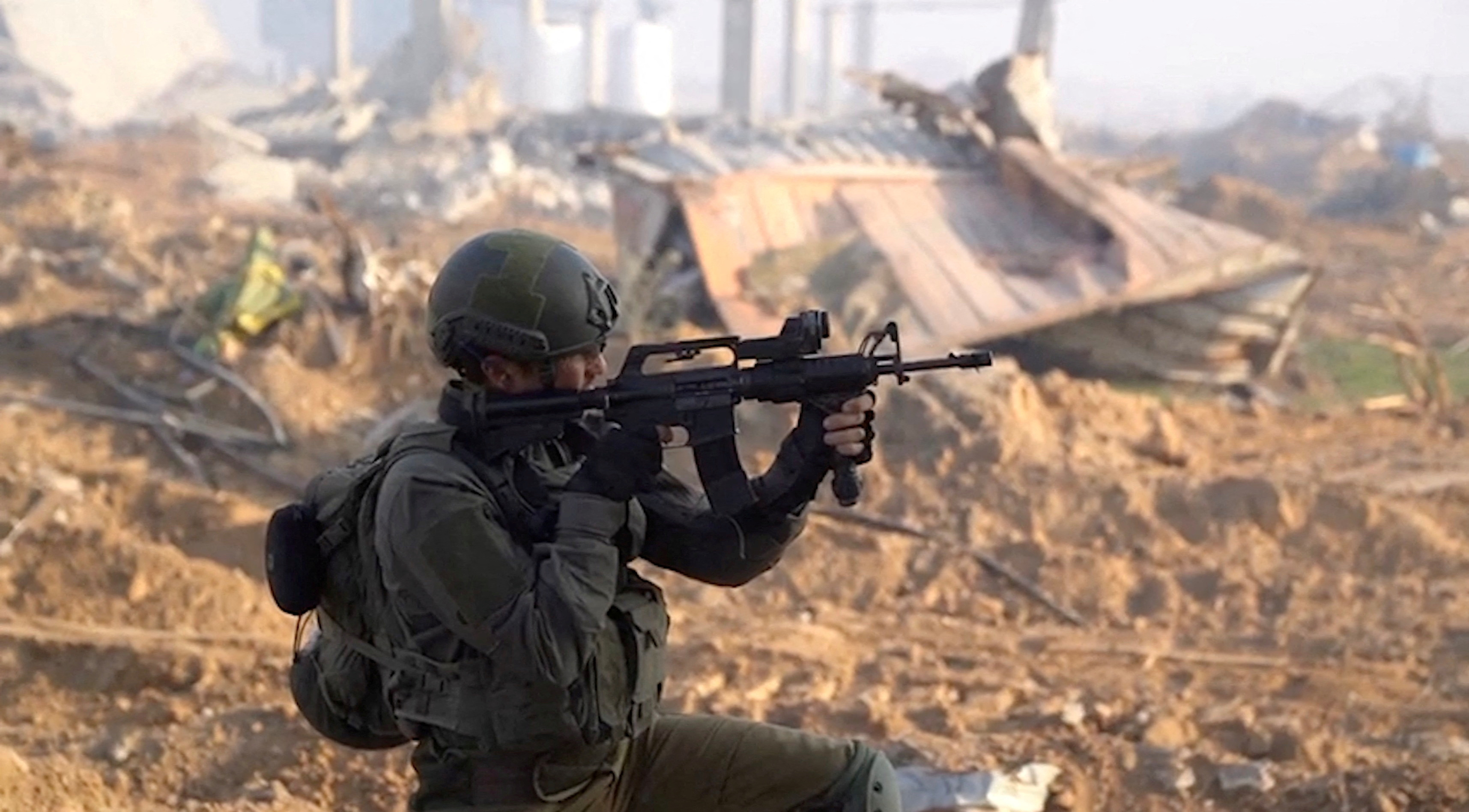An Israeli soldier operates at a location given as the Gaza Strip amid the ongoing conflict between Israel and the Palestinian Islamist group Hamas, in this screen grab obtained from a video released on January 8, 2024. Israel Defense Forces/Handout via REUTERS THIS IMAGE HAS BEEN SUPPLIED BY A THIRD PARTY