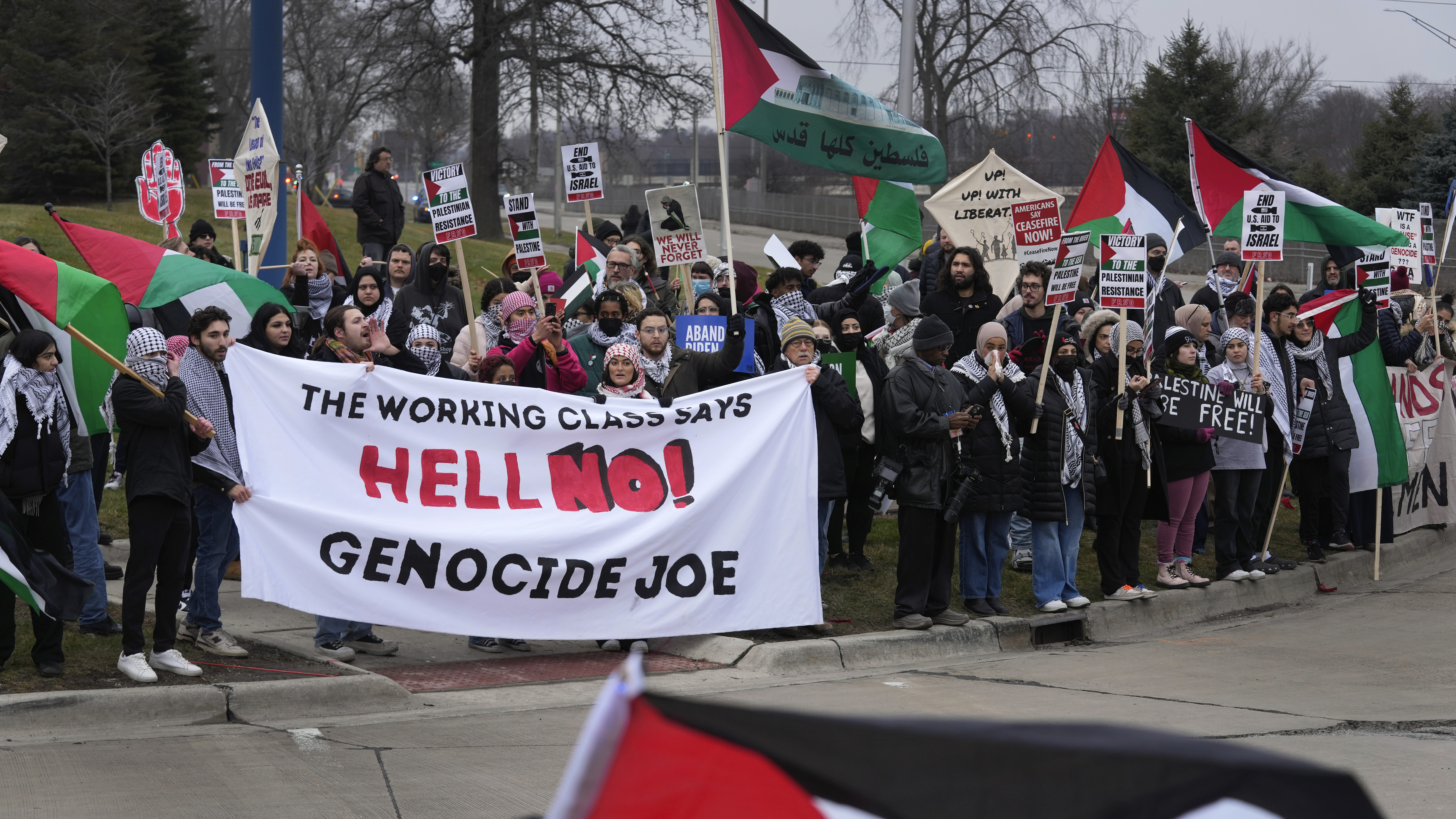Pro-Palestinian demonstrators march during a visit by President Joe Biden in Warren, Mich., Thursday, Feb. 1, 2024. (AP Photo/Paul Sancya)