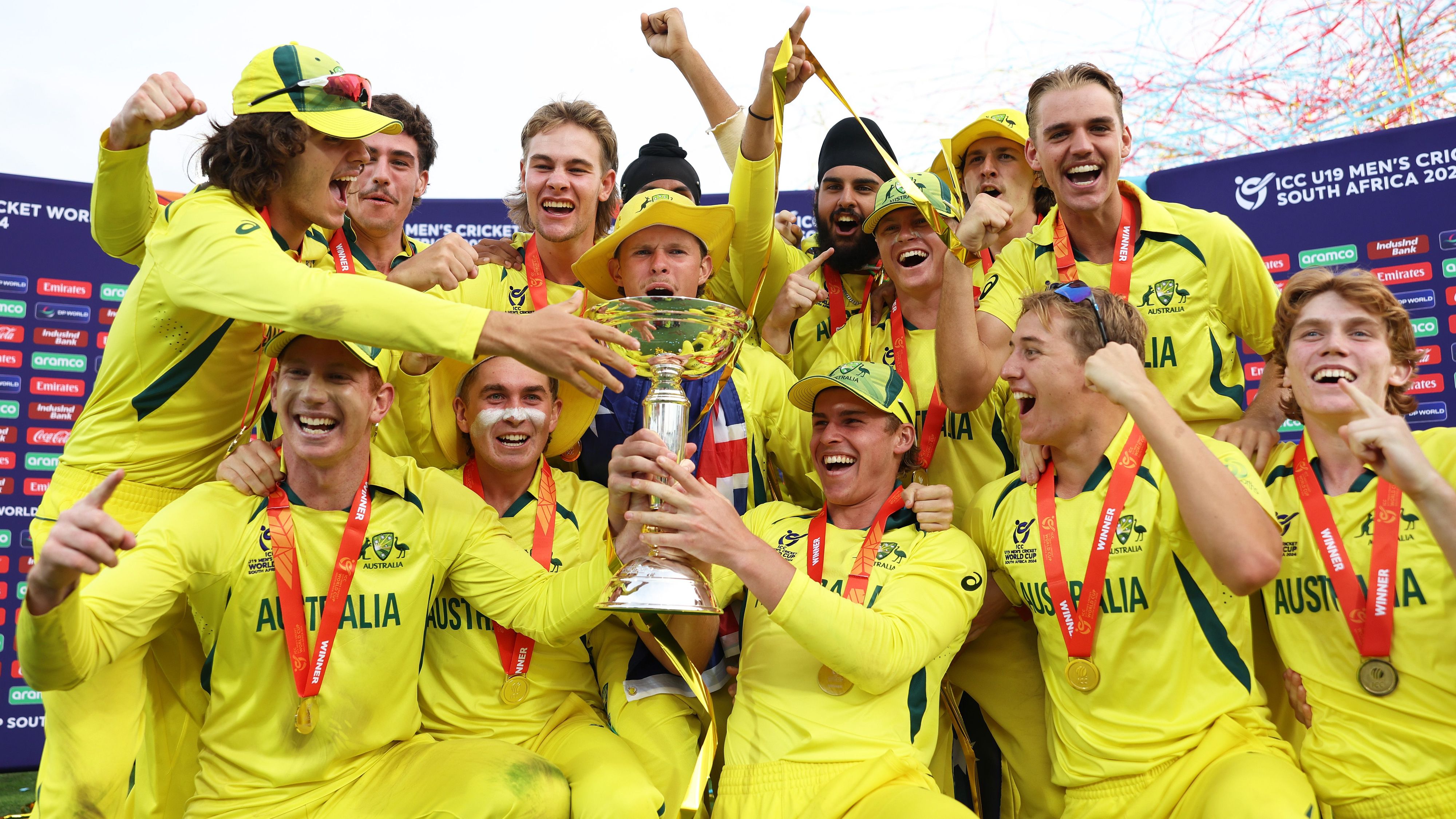 Australia captain Hugh Weibgen lifts the ICC Under-19 Cricket World Cup trophy with teammates as they celebrate after defeating India in the final in South Africa [Courtesy of International Cricket Council]