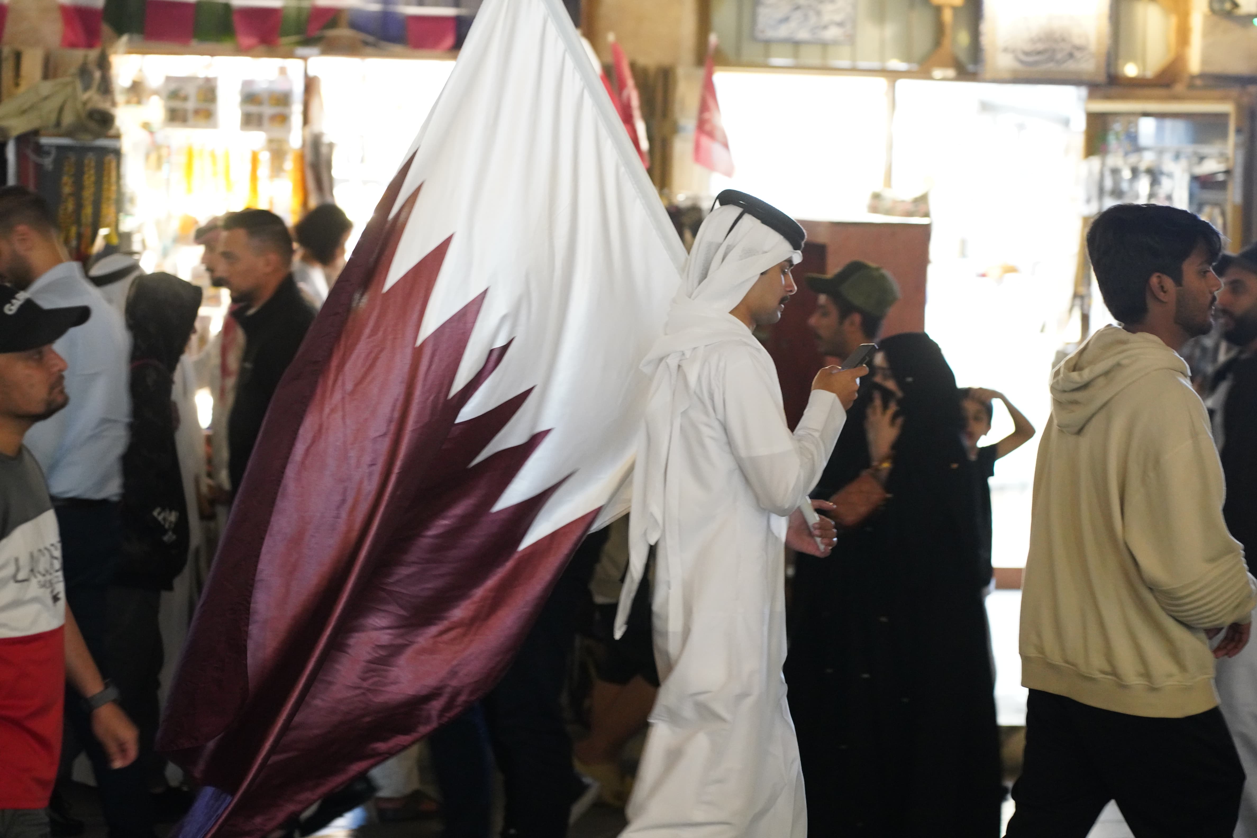 Qatar fans celebrate their team winning the AFC Asian Cup in Doha's Souq Waqif [Sorin Furcoi/Al Jazeera]