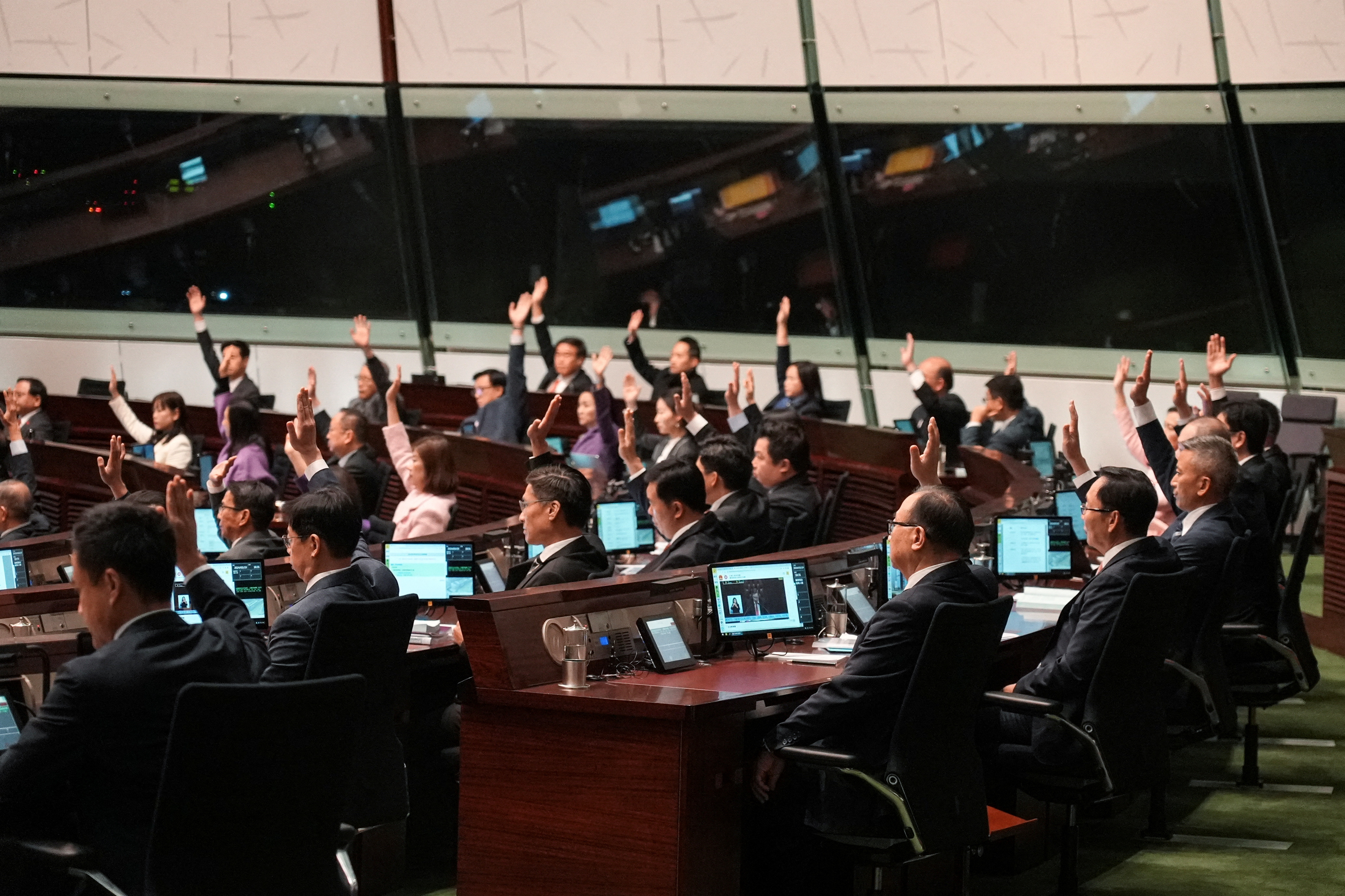 Lawmakers vote during the second reading of Safeguarding National Security Bill, also referred to as Basic Law Article 23, at the Hong Kong’s Legislative Council, in Hong Kong, China March 19, 2024.