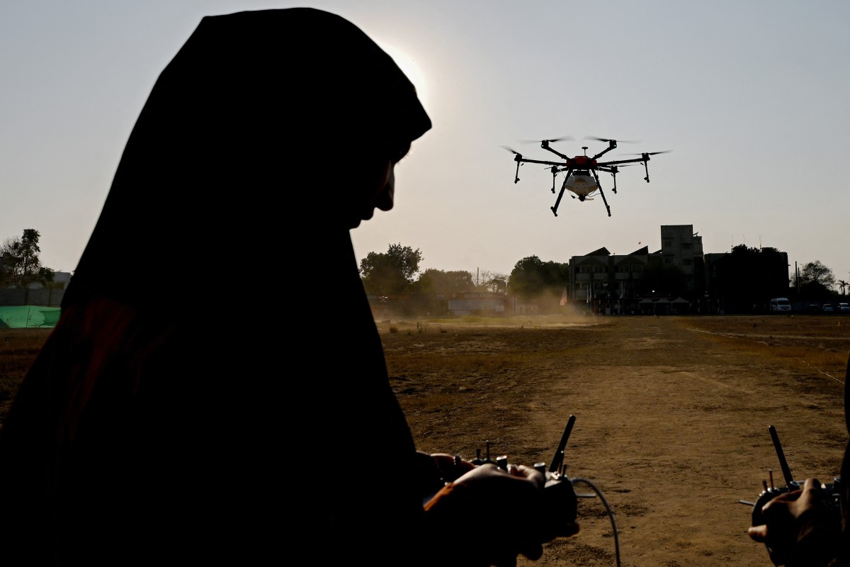 a woman aspiring to be a remote pilot operating a drone under the government-backed "Drone Sister" programme, at Drone Destination training centre in Manesar